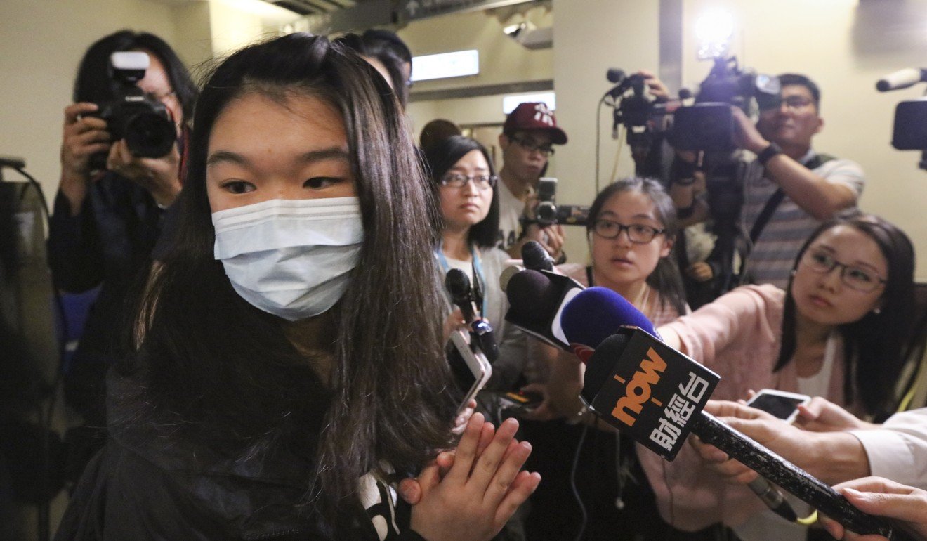 Michelle (in mask), the daughter of patient Tang Kwai-sze, said the family was never informed about the mistake until they questioned the hospital about her mother’s sudden liver condition. Photo: Felix Wong