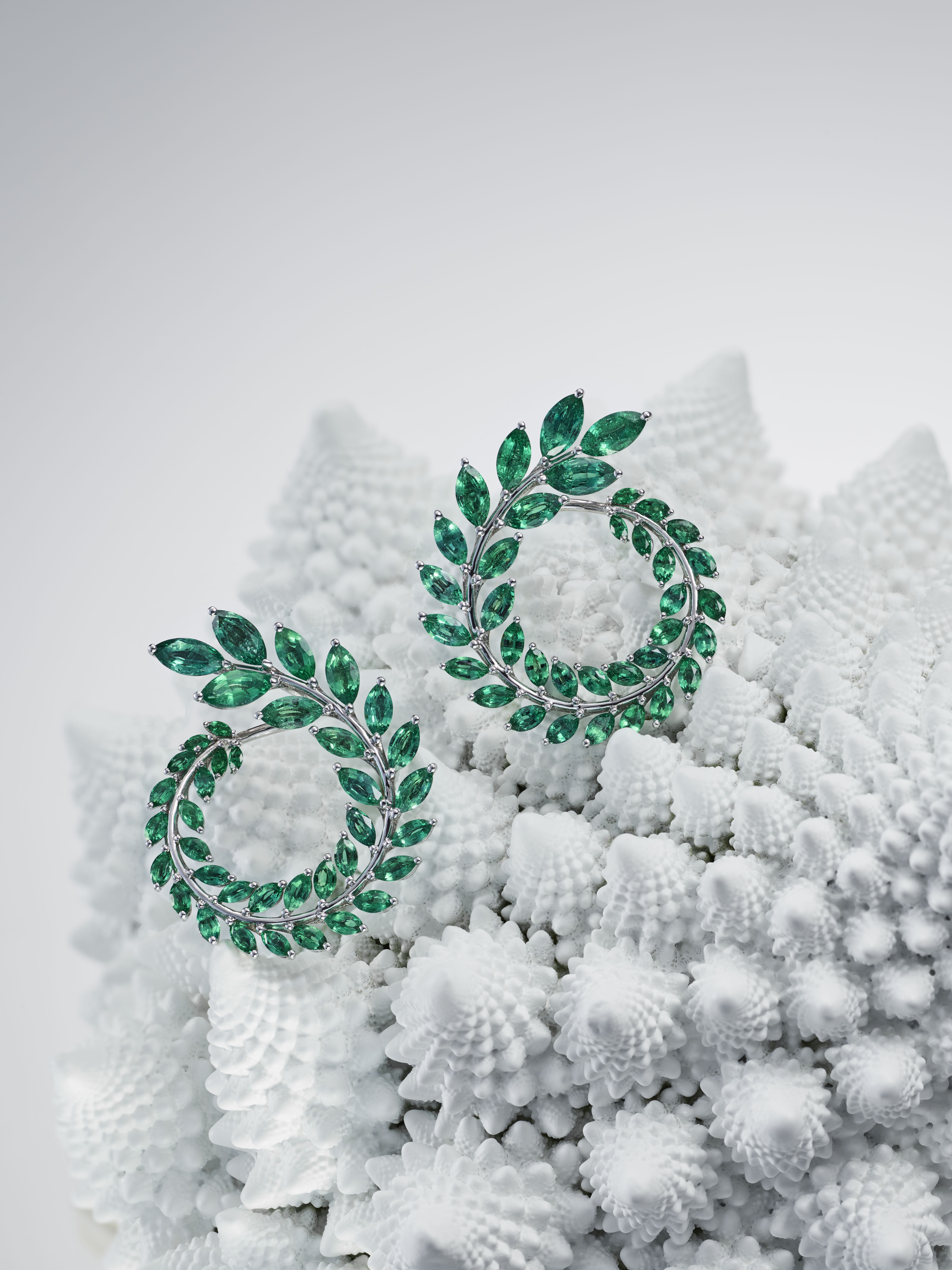 Chopard earrings made with 18ct white Fairmined gold set with ethically sourced marquise-cut emeralds from Gemfields' Kagem mine in Zambia.