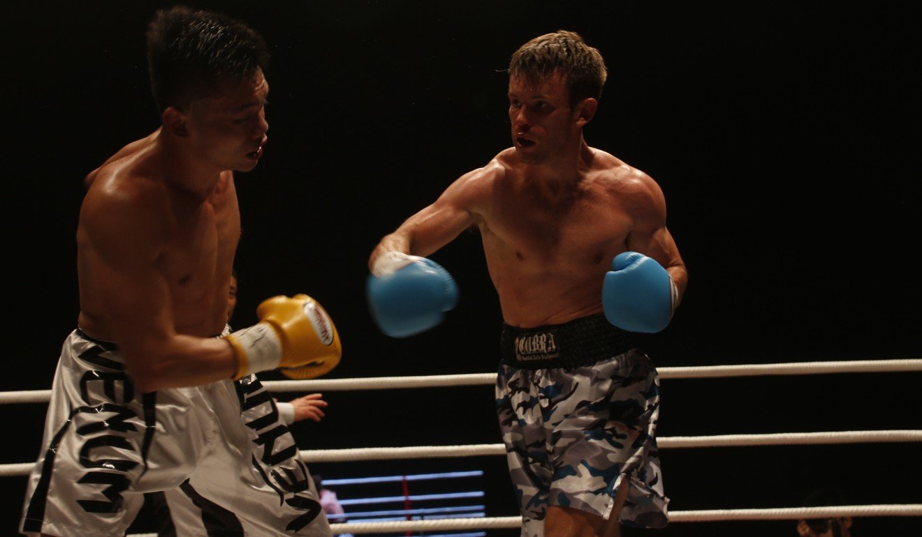 Tom Taw (right) in action against Chan Chun-hin.