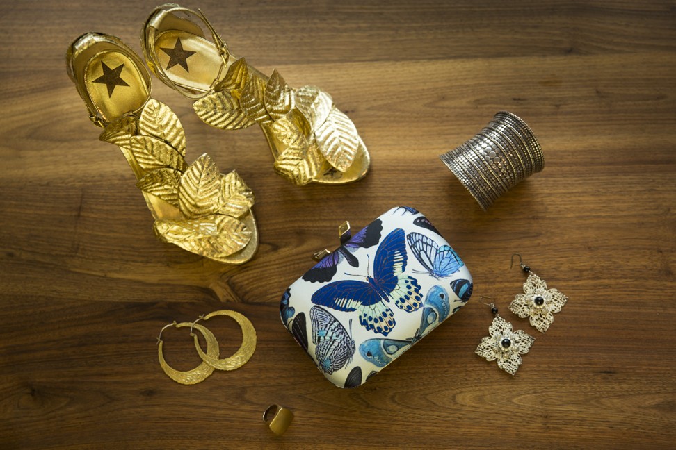 Shoes and butterfly clutch by Kotur, John Hardy cuff, gold-coloured earrings from a market in Bali, square flower earrings from a boutique in Paris and ring by Spy Henry Lau. Photo: Michelle Wong
