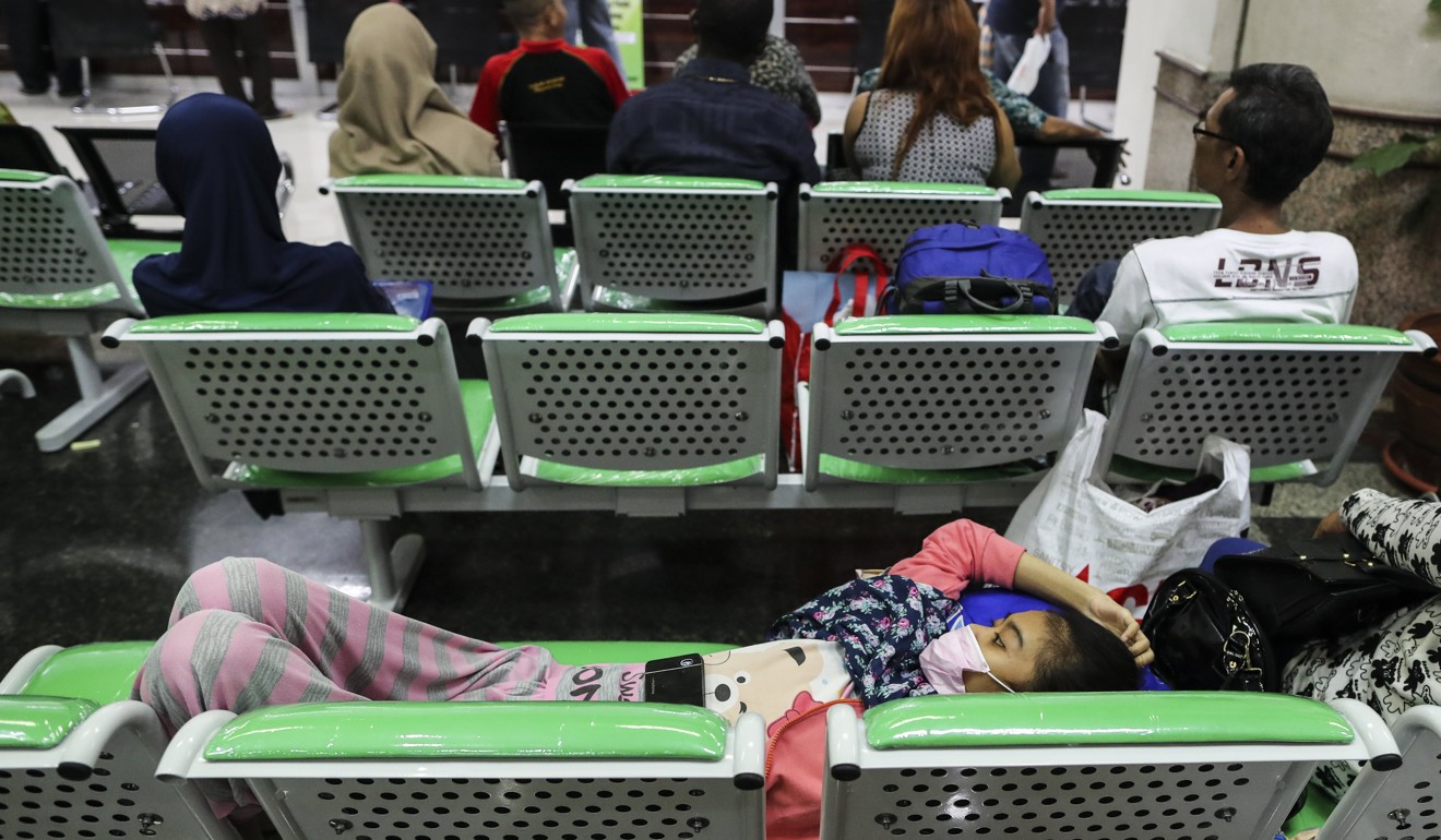 Indonesian patients wait at the Dharmais Hospital, after its IT system was hit by the WannaCry computer virus. Photo: EPA