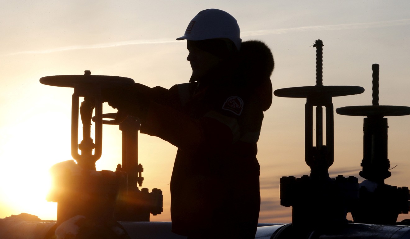 A worker checks the valve of an oil pipe at the Lukoil owned Imilorskoye oil field near Kogalym, Russia. OPEC and other major producers like Russia are expected to extend production cuts into 2018. Photo: Reuters