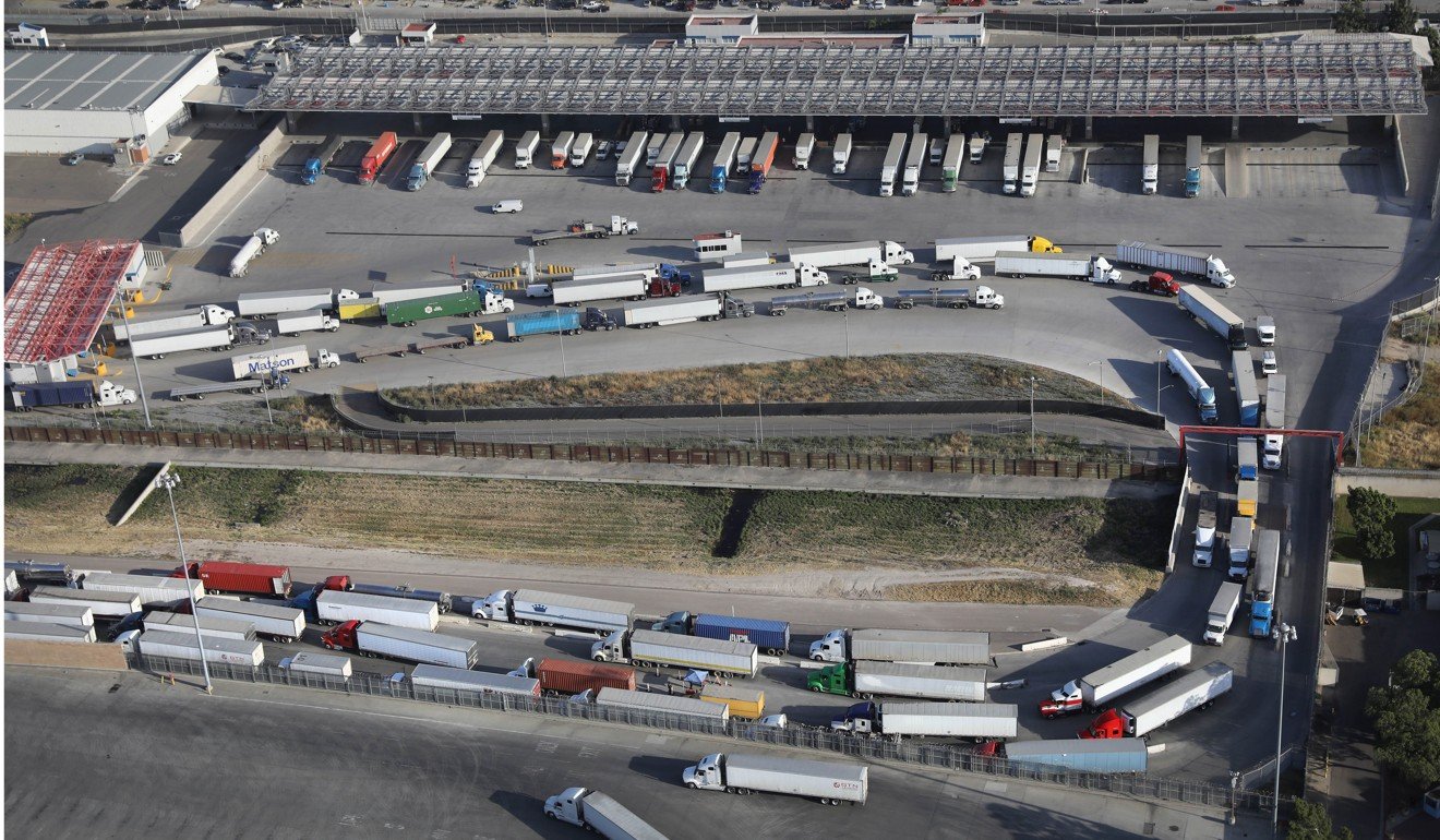 Freight trucks snake from Mexico into California last month as they stop for inspection at US customs at Otay Mesa, near San Diego, California. With over three-quarters of their exports destined for the US, Canada and Mexico have in recent years been working to reduce their dependence by diversifying their trading partners. Photo: AFP