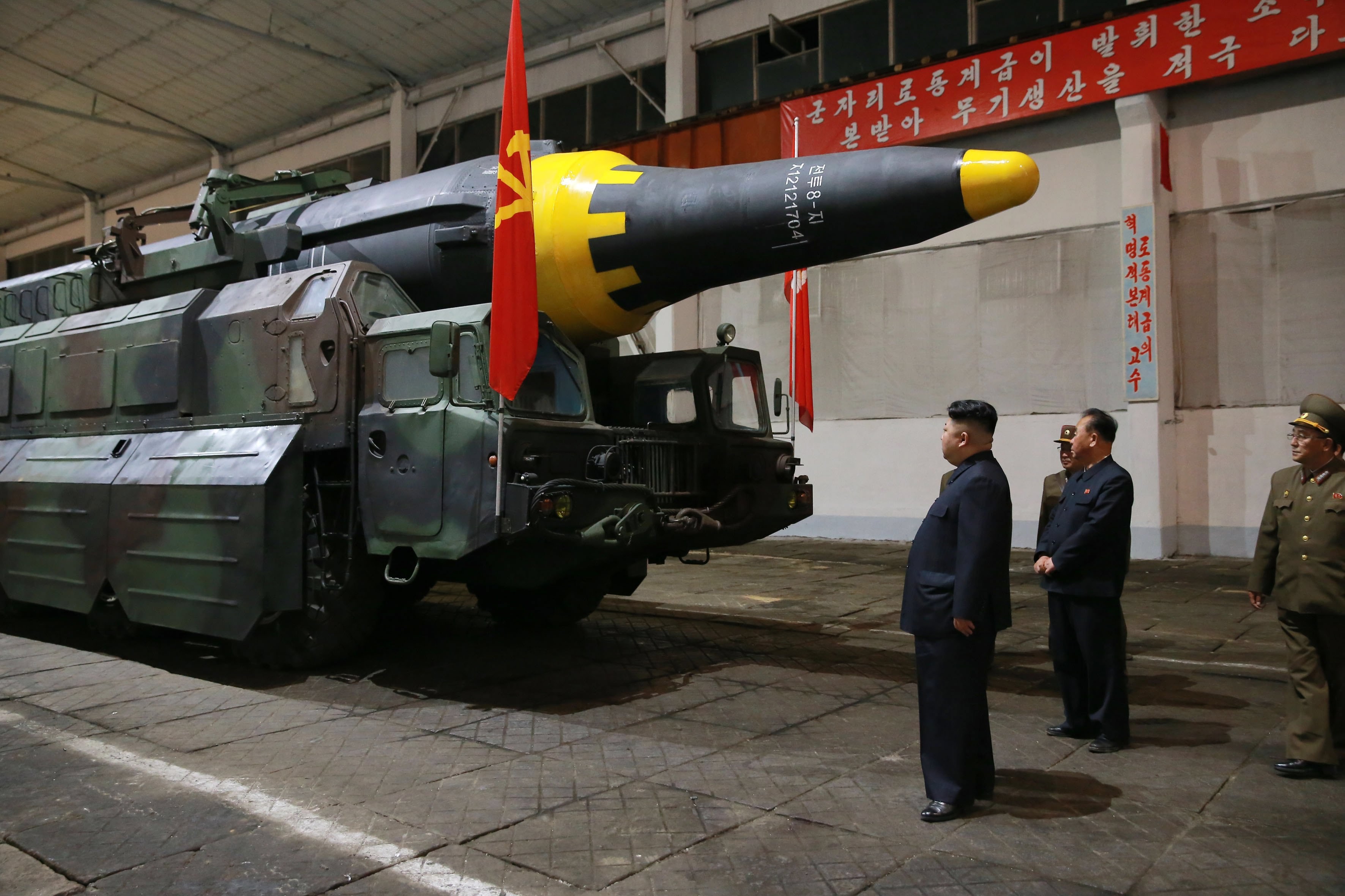 North Korean leader Kim Jong-un inspects a missile after Pyongyang said it had successfully test-fired a new ground-to-ground medium long-range strategic ballistic rocket on May 14. Photo: EPA