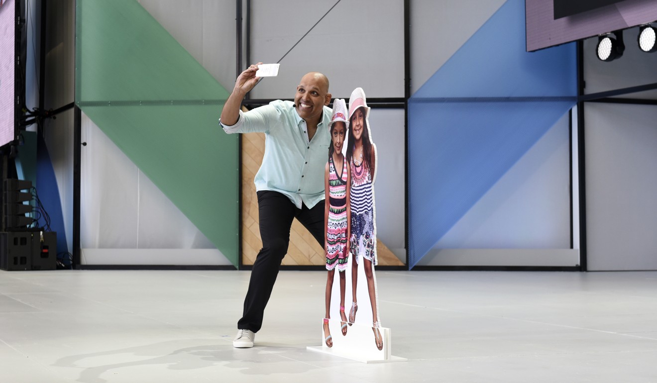 Anil Sabharwal, vice president of Google Photos at Google, demonstrates a new feature that suggests who to share photos with at the Google I/O 2017 Conference. Photo: Bloomberg