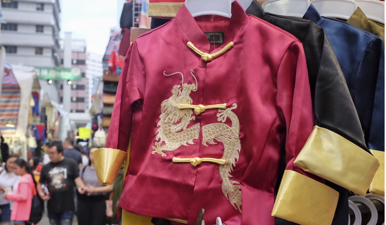 Clothing for all ages, such as this dragon design Chinese style jacket, can be found at the Ladies’ Market. Photo: Alkira Reinfrank