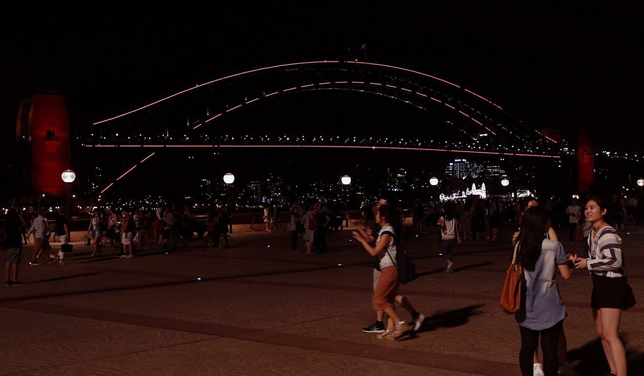 Australia's iconic Harbour Bridge is lit up in red for the Lunar New Year celebrations. Photo: AFP