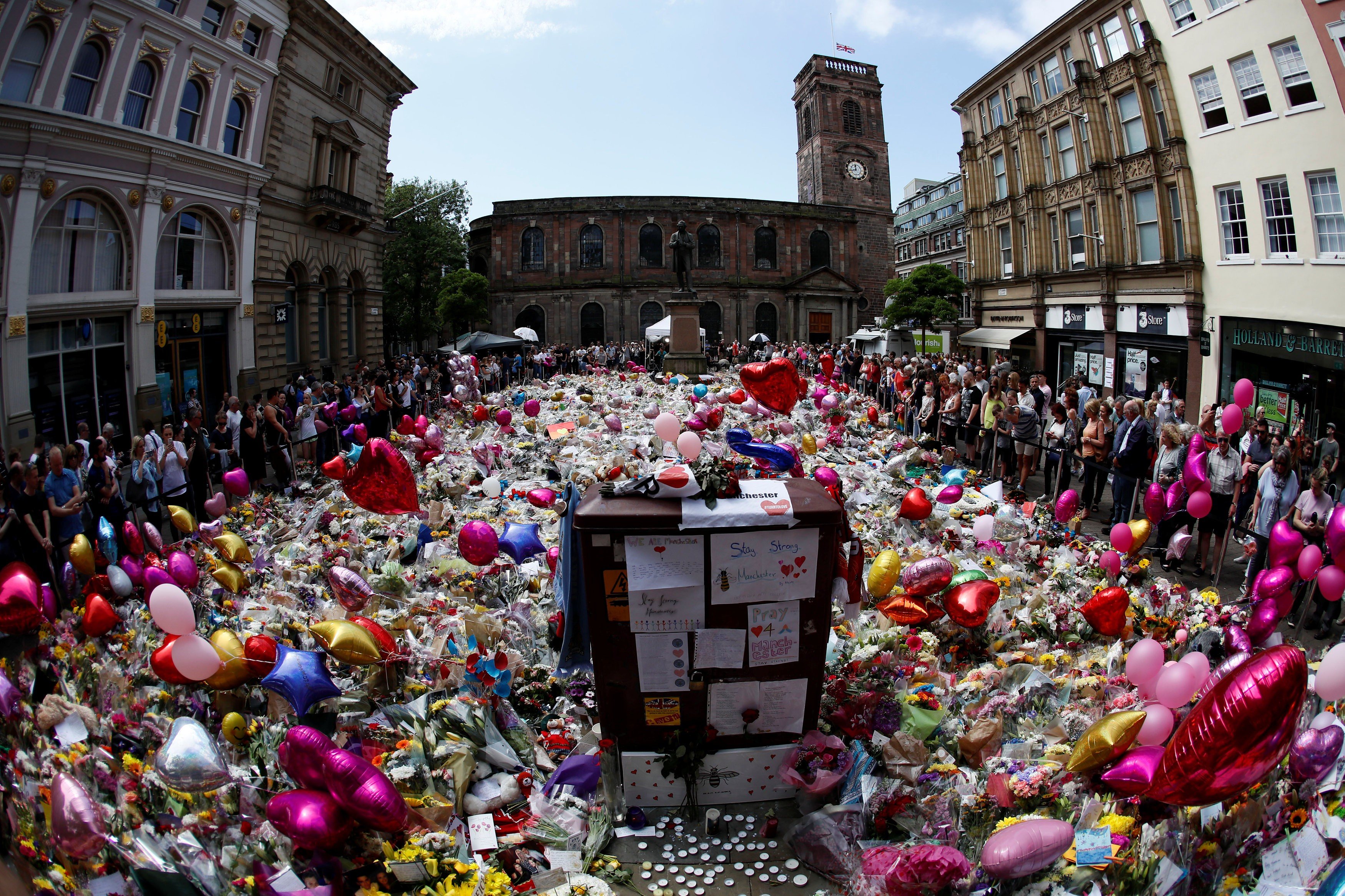 Floral and handwritten tributes for the victims of the Manchester Arena attack, at St Ann’s Square in central Manchester, on May 27. Photo: Reuters