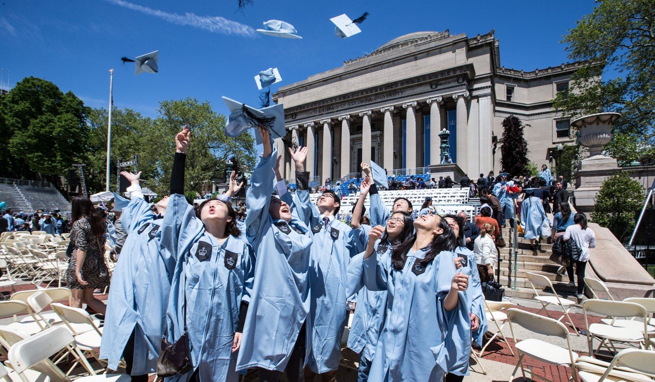 Chinese graduates throw their caps into the air after the commencement ceremony at Columbia University in New York in May last year. Photo: Xinhua