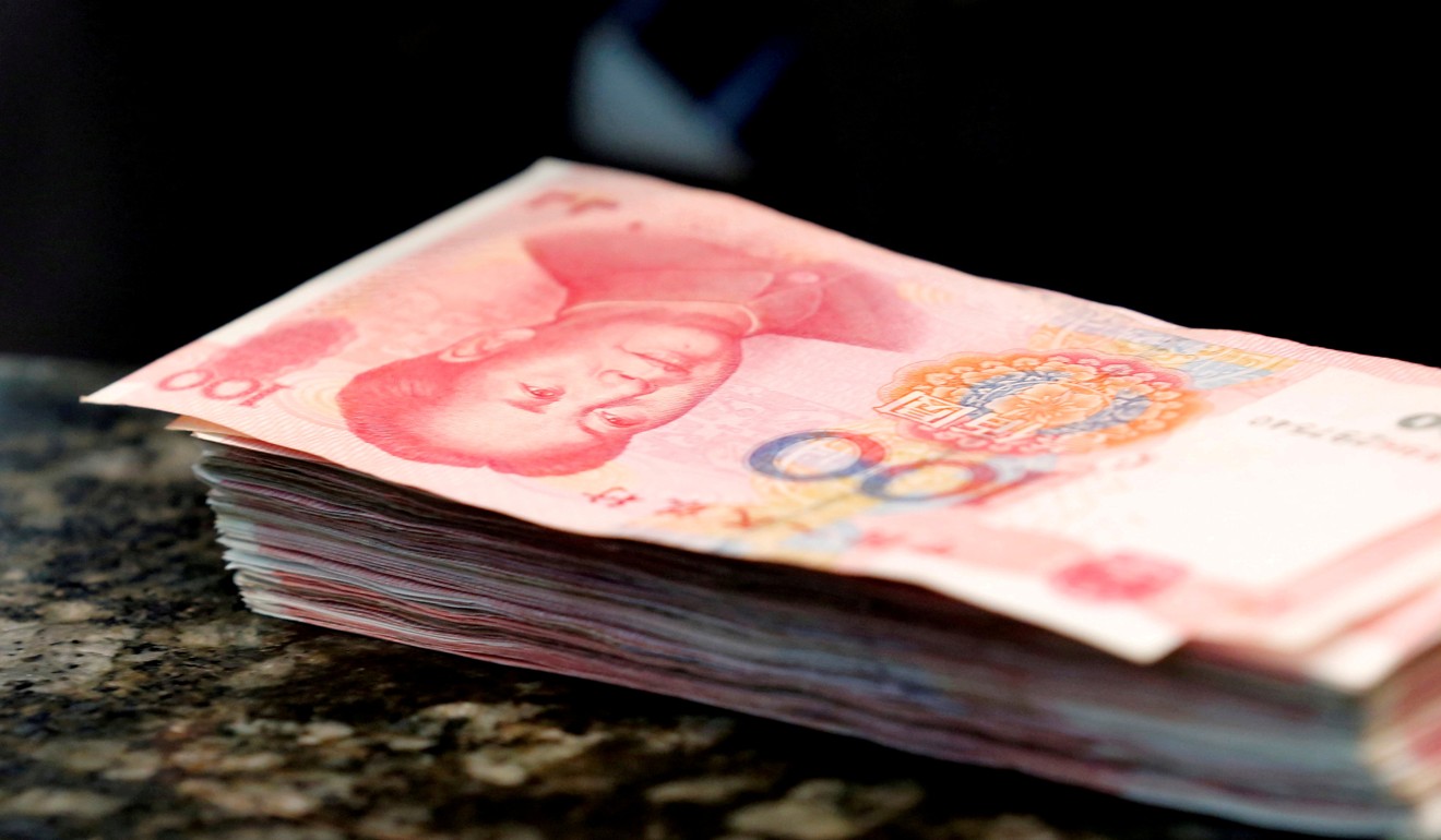 In response to the liquidity squeeze, the yuan spot rate in the currency market has climbed to its strongest level in seven months – but it’s still just 2 per cent higher this year, and is underperforming the region. Photo: Reuters