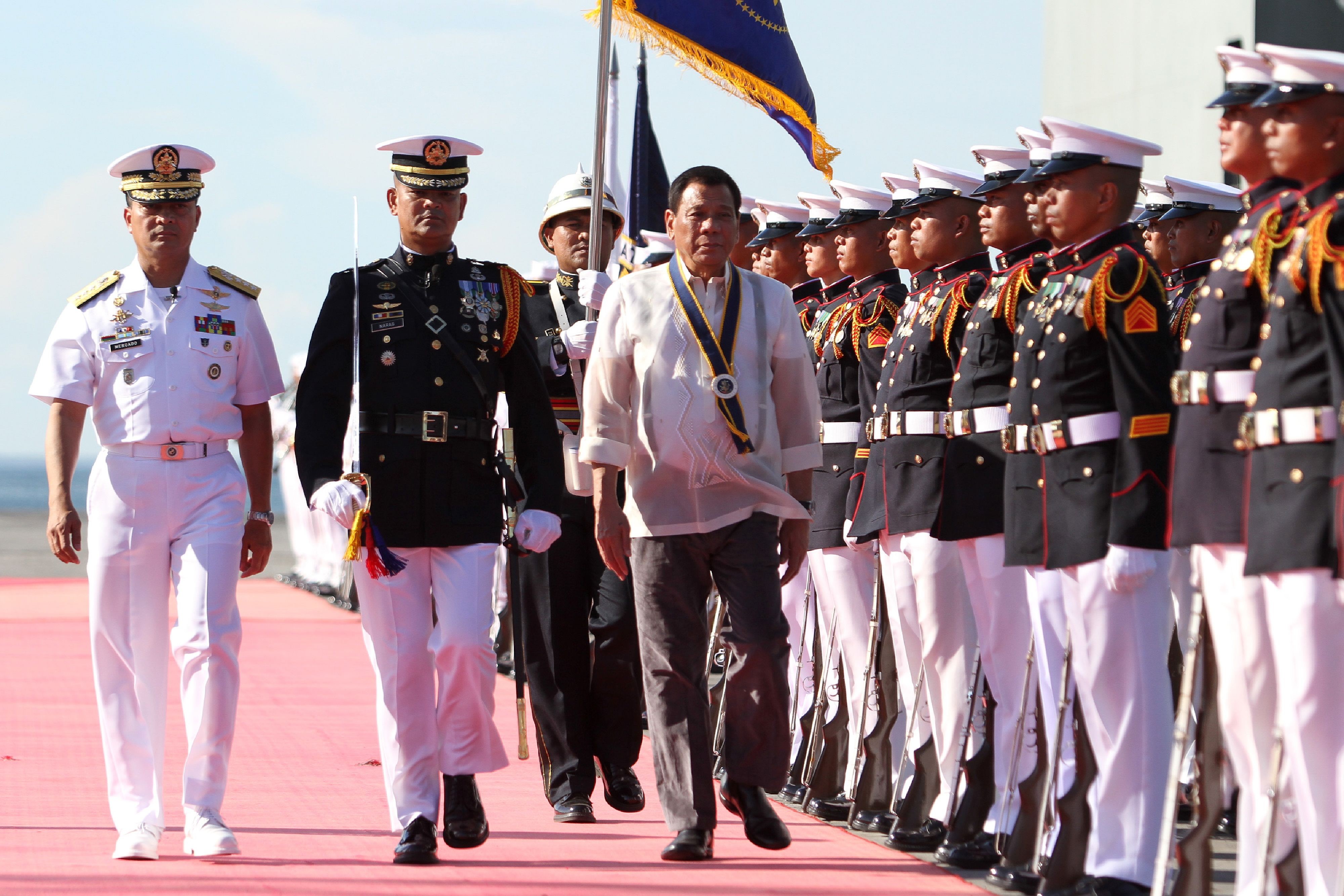 President Rodrigo Duterte inspects an honour guard as he attends celebrations for the 119th anniversary of the Philippine Navy in Davao, Mindanao, on May 31. Duterte imposed martial law in Mindanao on May 23. Photo: AFP