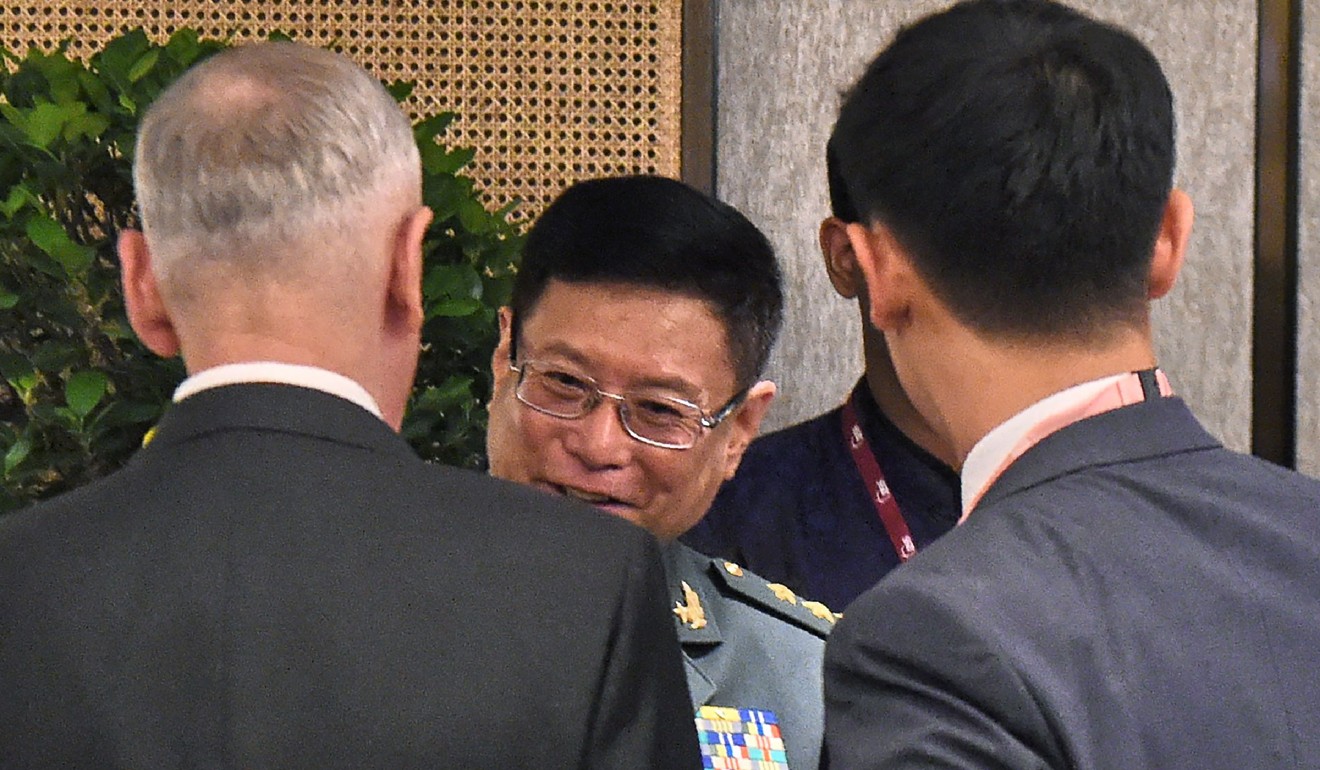 China Lieutenant General He Lei, centre, talks to US Defence Secretary James Mattis, left, at the 16th Shangri-La Dialogue Summit in Singapore on Saturday. Photo: AFP