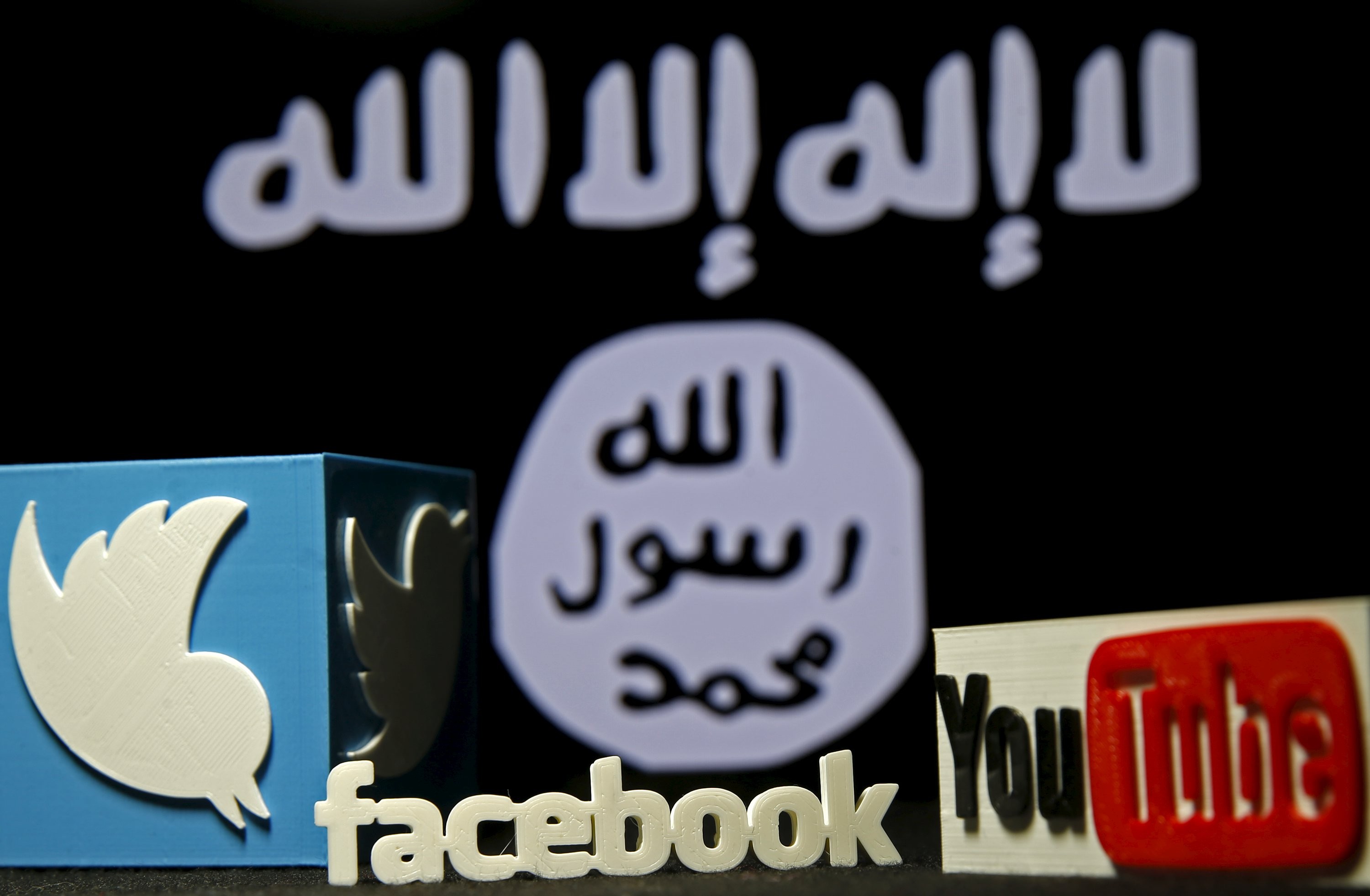 Three-dimensional plastic representations of the Twitter, Facebook and YouTube logos in front of a flag of so-called Islamic State, displayed in the Bosnian city of Zenica, on February 3 last year. Terrorist groups rely heavily on social media and the internet to spread jihadist propaganda. Photo: Reuters