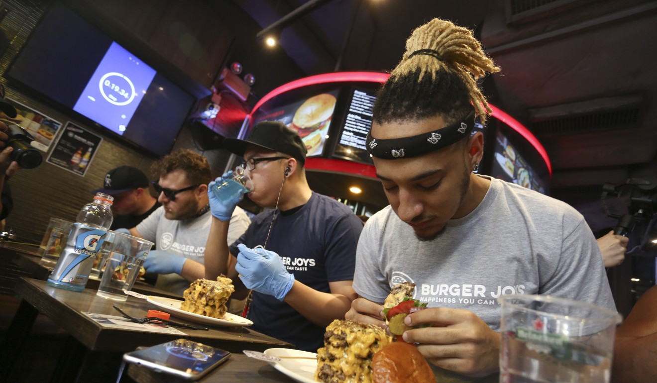 Competitors had 20 minutes to eat the burger. Photo: Jonathan Wong