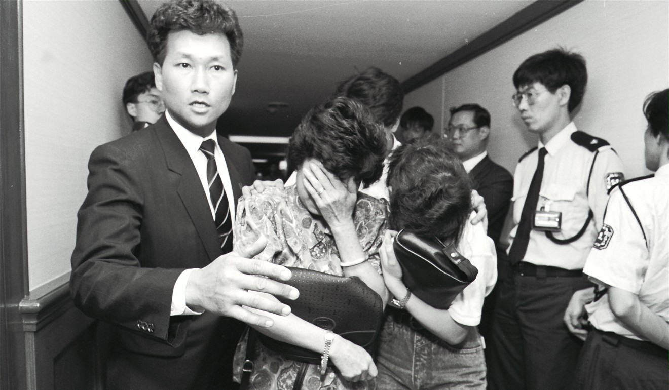 Relatives of the victims arrive at the Hilton Hotel to check the latest news of the crash. Picture: SCMP