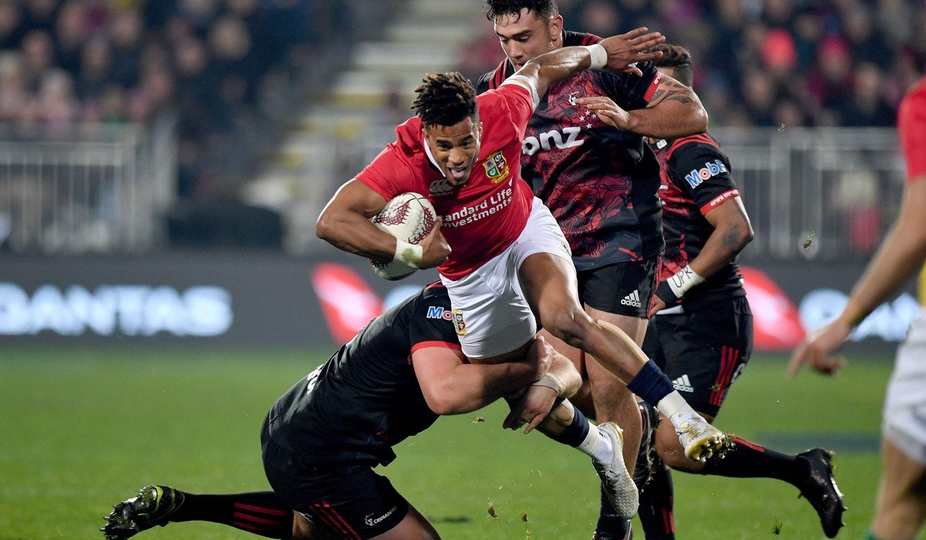 The Lions’ Anthony Watson (centre) is tackled by Crusaders’ Joe Moody (left) and Codie Taylor (back). Photo: AFP