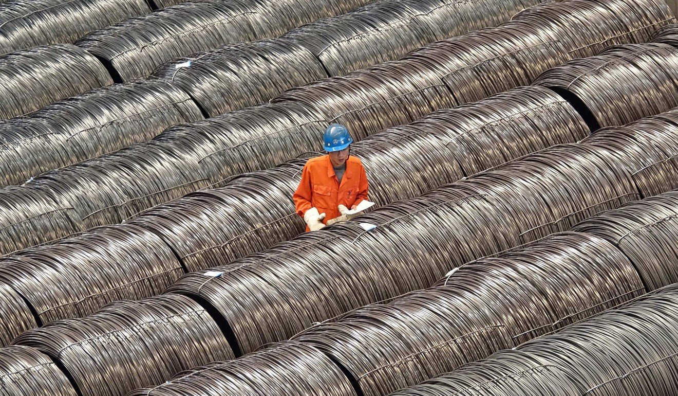 A worker checks steel wires at a warehouse in Dalian, Liaoning. The province plays a major role in China’s steel sector. Photo: Reuters