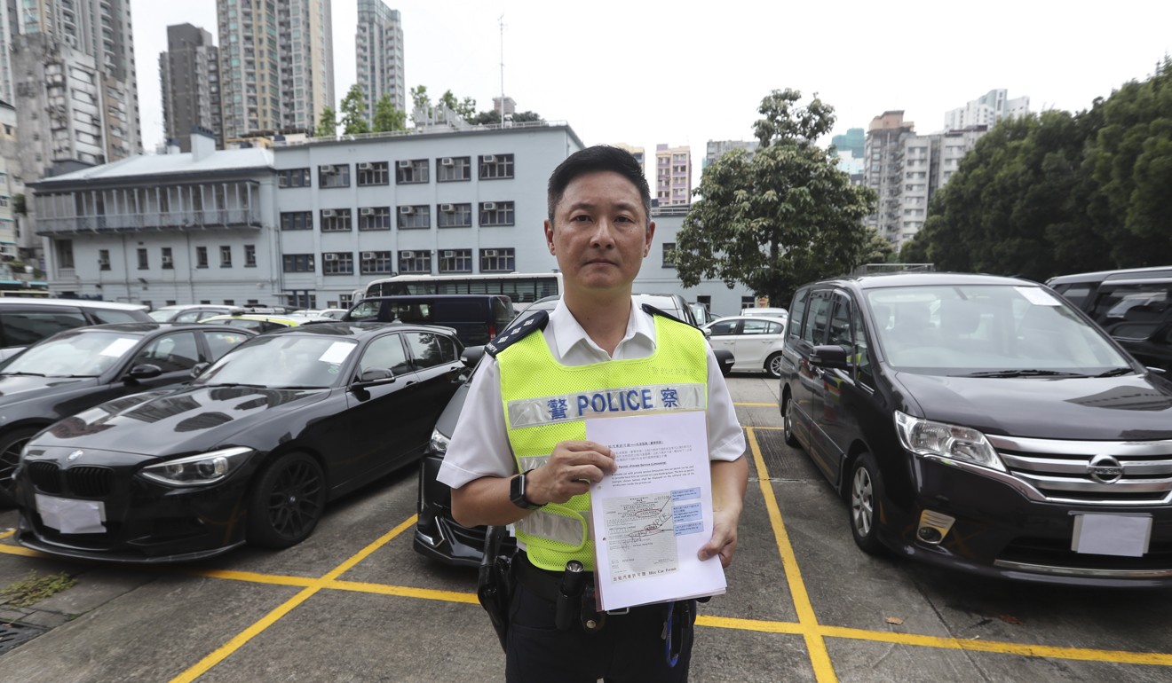 A police chief inspector briefs the media after more than 20 Uber drivers were arrested and several vehicles seized, in an undercover operation on May 23. Photo: Edward Wong
