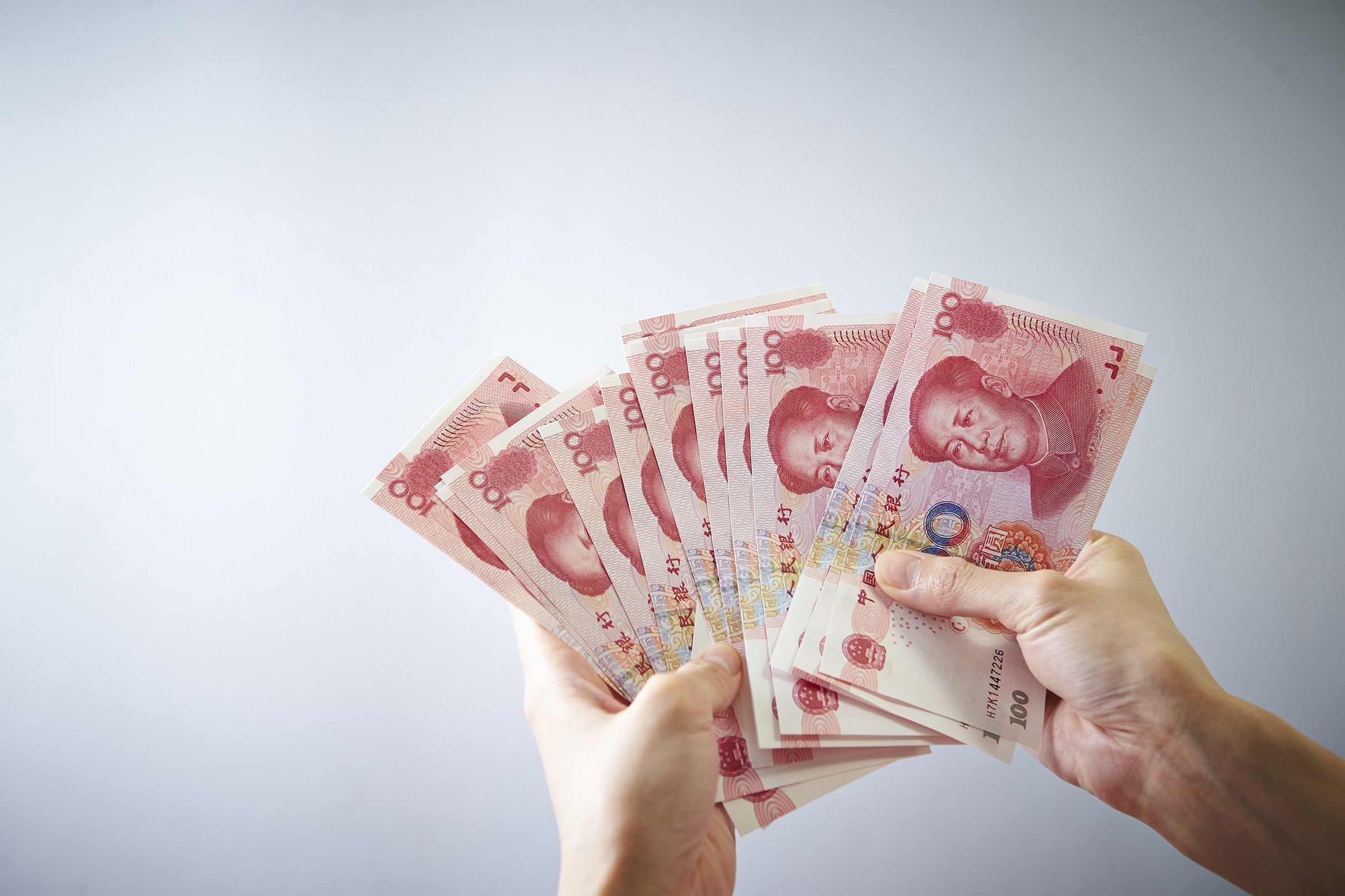 A stack of crisp renminbi notes. Photo: Shutterstock