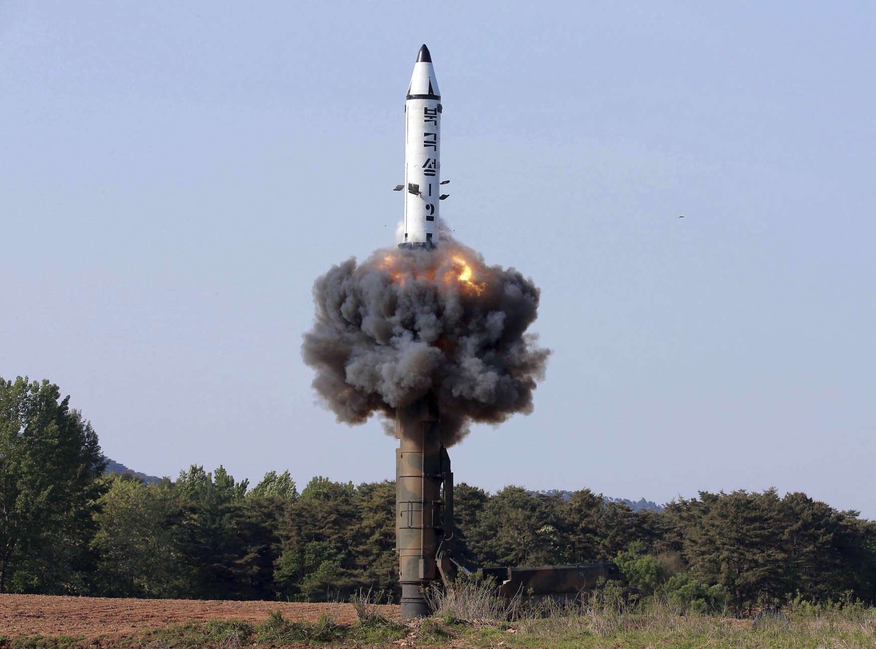 North Korea tests a solid-fuel rocket in this May 22 photo distributed by the North Korean government. Photo: AP