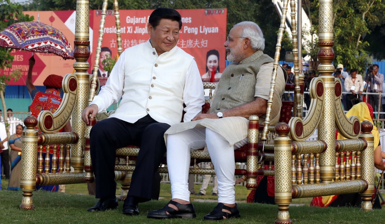 Visiting President Xi Jinping chats to Indian Prime Minister Narendra Modi as they sit on a swing in Gujarat, in September 2014. Photo: Xinhua