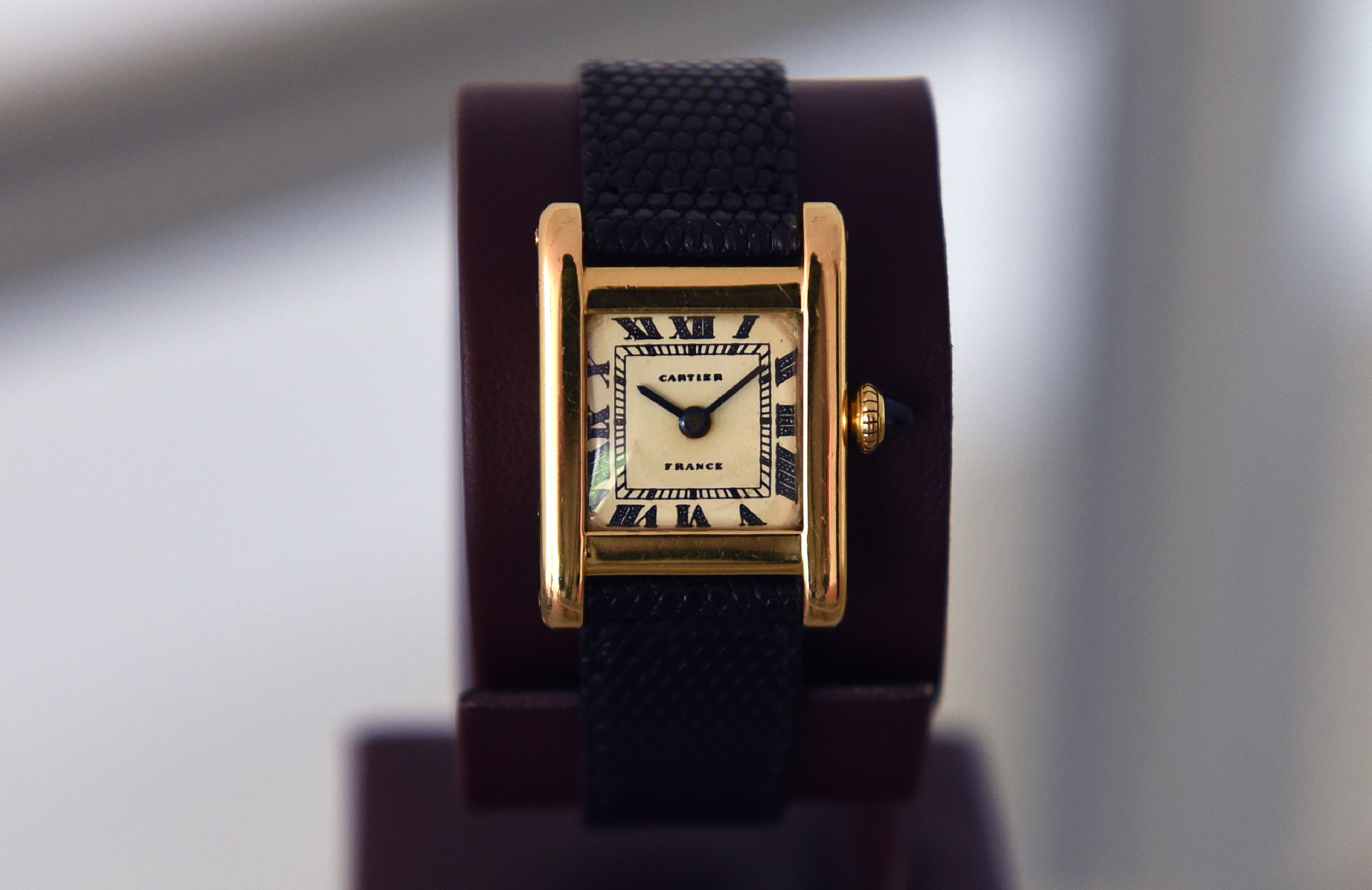 Cartier wristwatch and painting sold 