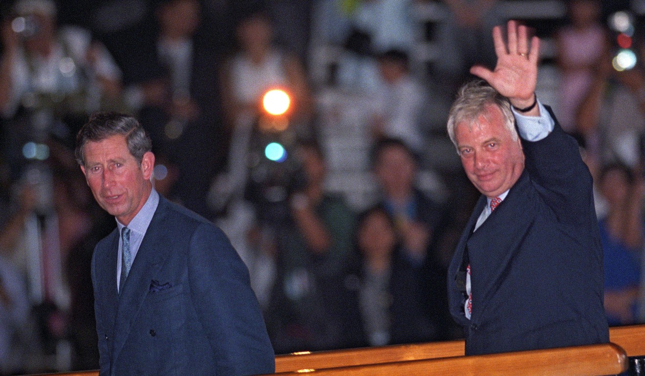 Outgoing Hong Kong governor Chris Patten waves as he boards the Royal Yacht Britannia accompanied by Britain’s Prince Charles. Photo: AFP