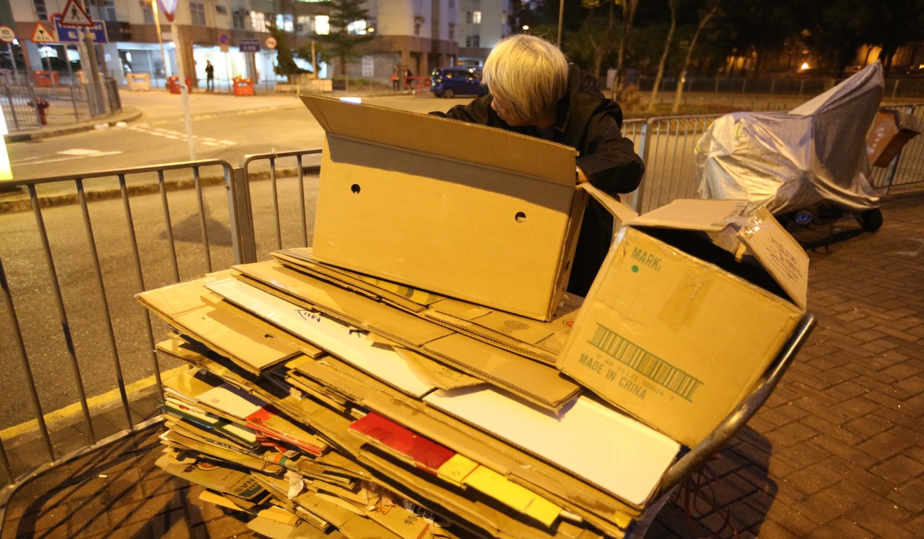 An elderly lady collects cardboard boxes in Mei Foo, Hong Kong. Photo: Edward Wong
