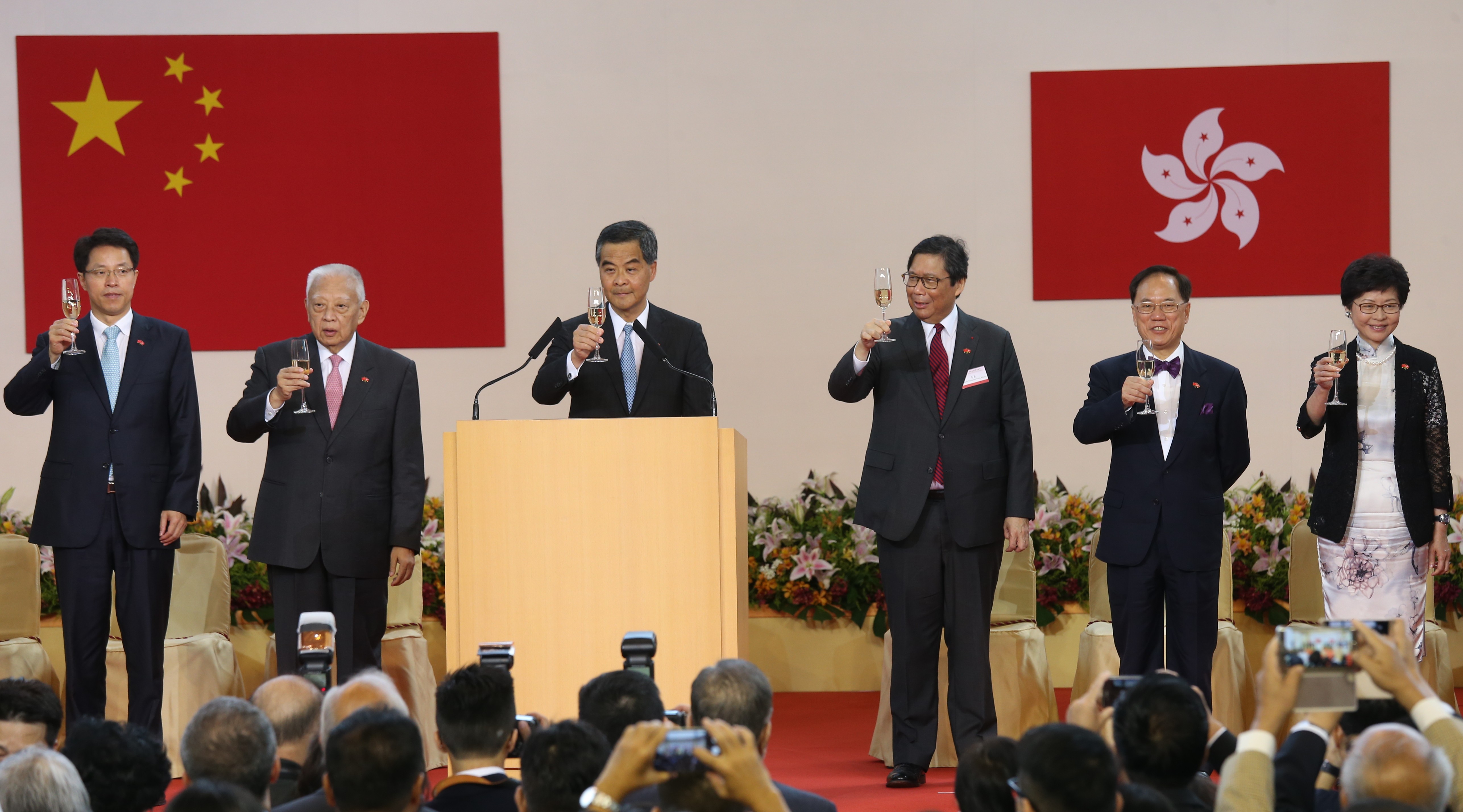 Chief Executive Leung Chun-ying officiates at the reception for the 19th anniversary of the establishment of the Hong Kong SAR last year, along with his predecessors Tung Chee-hwa (second left) and Donald Tsang (second right), and now chief executive-elect, Carrie Lam. Joining the toast is the liaison office director, Zhang Xiaoming (far left). Photo: Dickson Lee