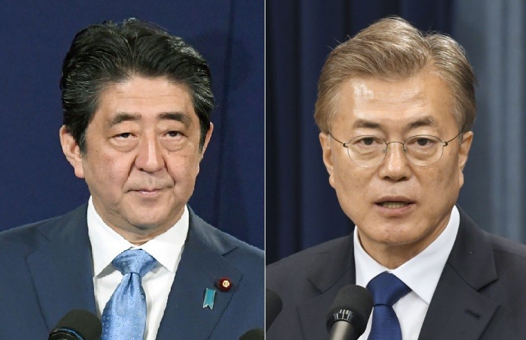 South Korean President Moon Jae-in (right) has made improved ties with Japan under Prime Minister Shinzo Abe a priority for his government, but obstacles remain to sustained reconciliation. Photo: Kyodo