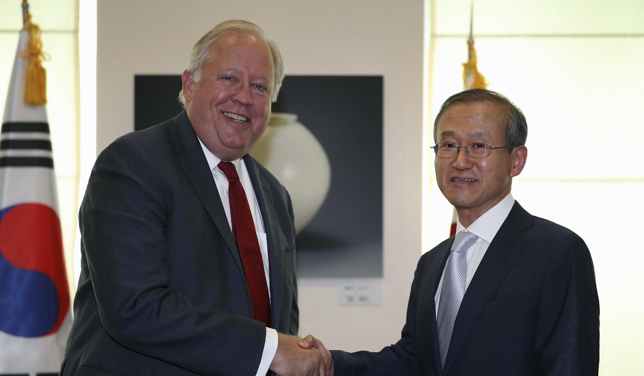 South Korea's Vice-Foreign Minister Lim Sung-nam and US Under Secretary of State Thomas Shannon shake hands ahead of their talks in Seoul on June 14. Photo: EPA