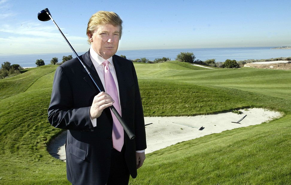 Then developer Donald Trump poses next to a bunker at his new golf course, the Trump National Golf Club, in California in 2005. US businesses will be wishing Trump had not cancelled their tee time. Photo: MCT