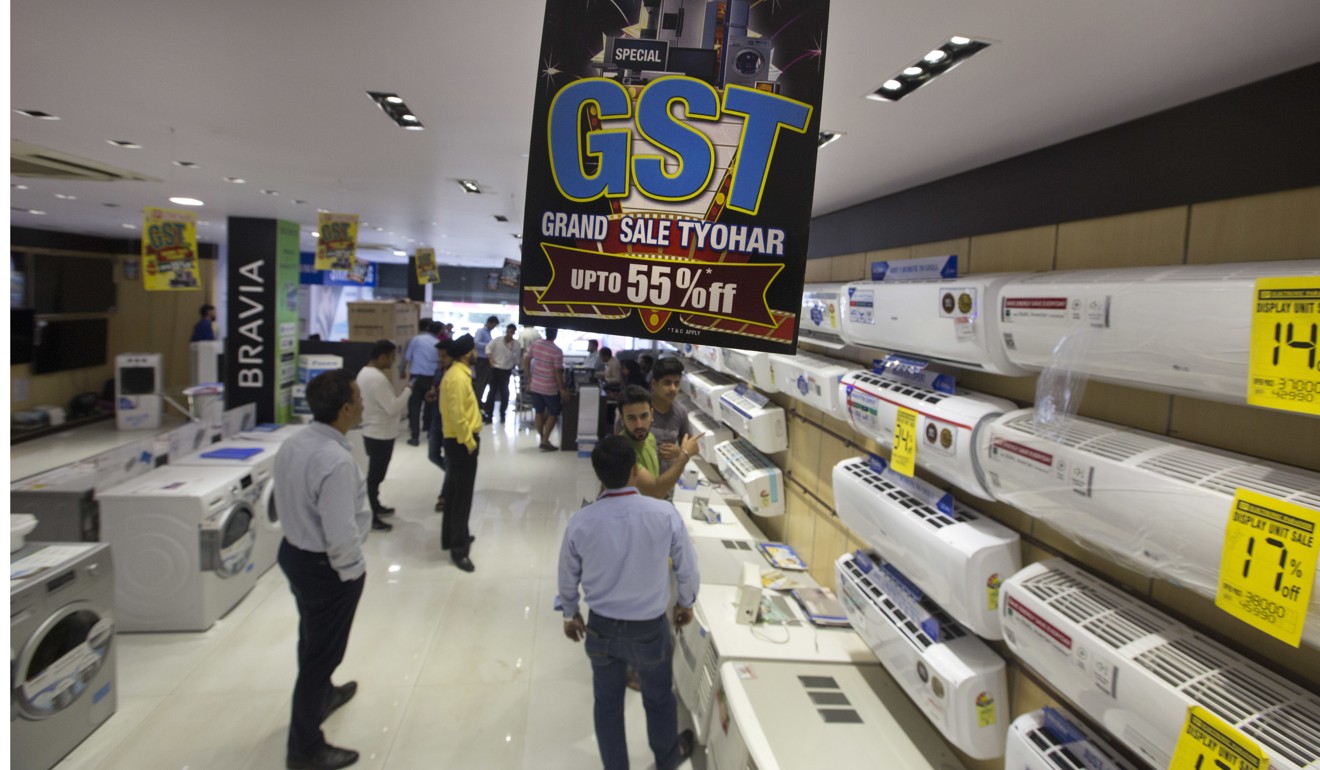 Indians shop in New Delhi before the new Goods and Services Tax scheme kicks in, which could increase prices. Photo: AP