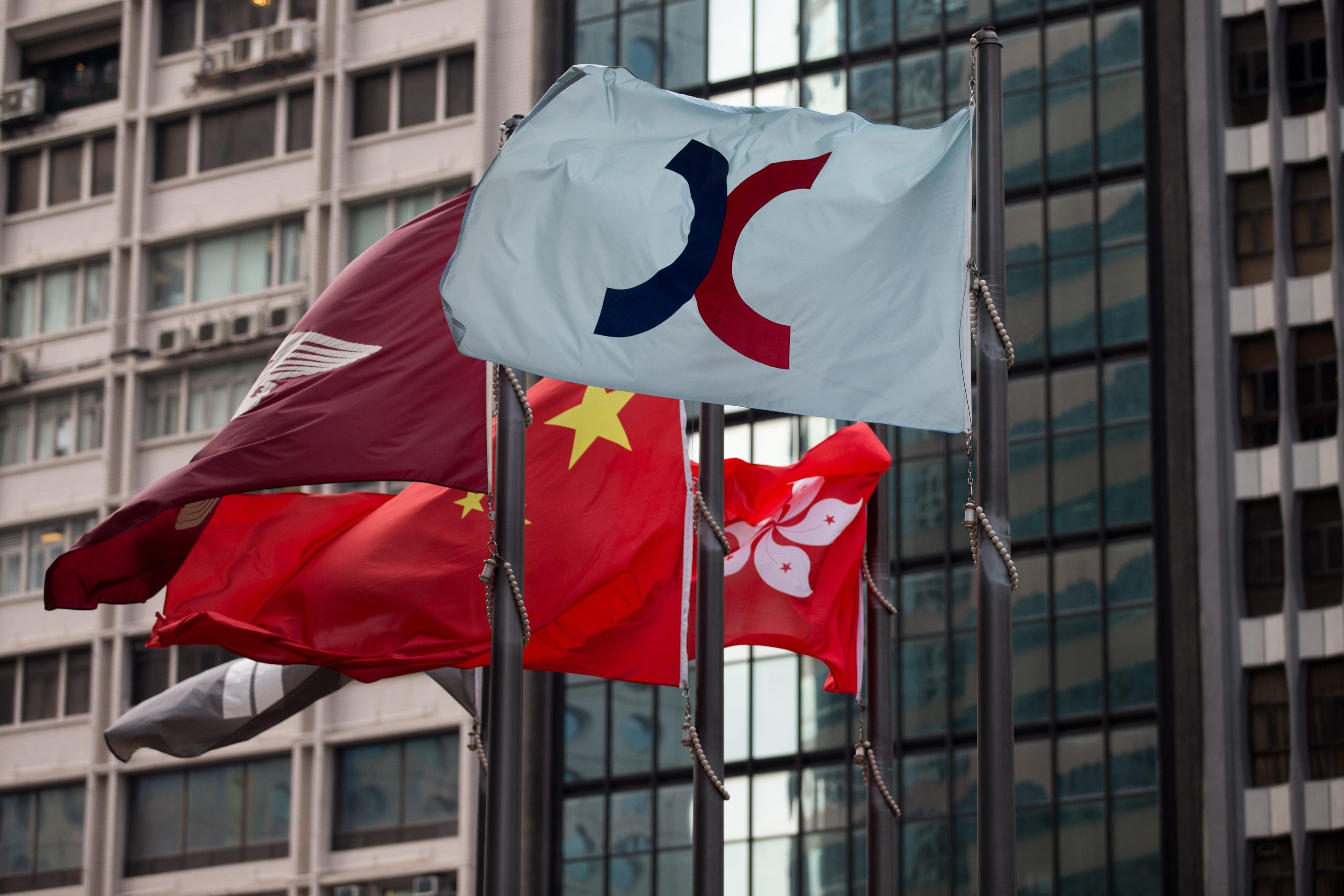 The flag of the Hong Kong Exchanges and Clearing flies outside the bourse in Hong Kong. Photo: EPA