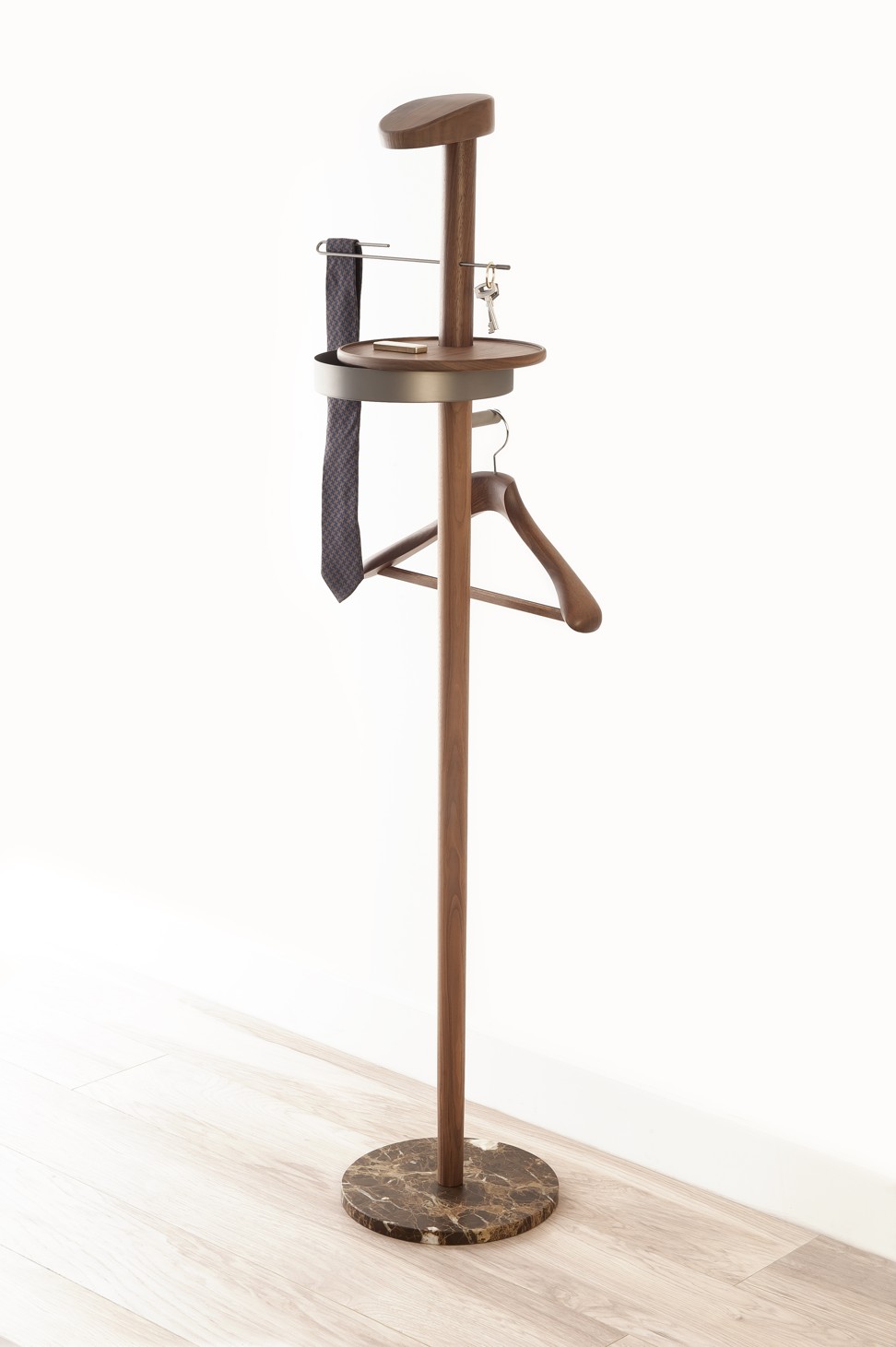 A reinterpretation of classic suit valet, the multifunctional clothes stand with a chic marble base is a must-have for the sophisticated gentleman. Price on Request