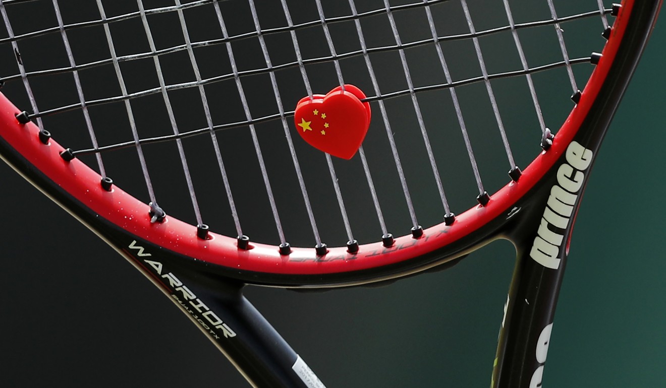 A Chinese flag-themed, heart-shaped string vibration dampener is pictured on the strings of China's Peng Shuai’s racquet. Photo: AFP