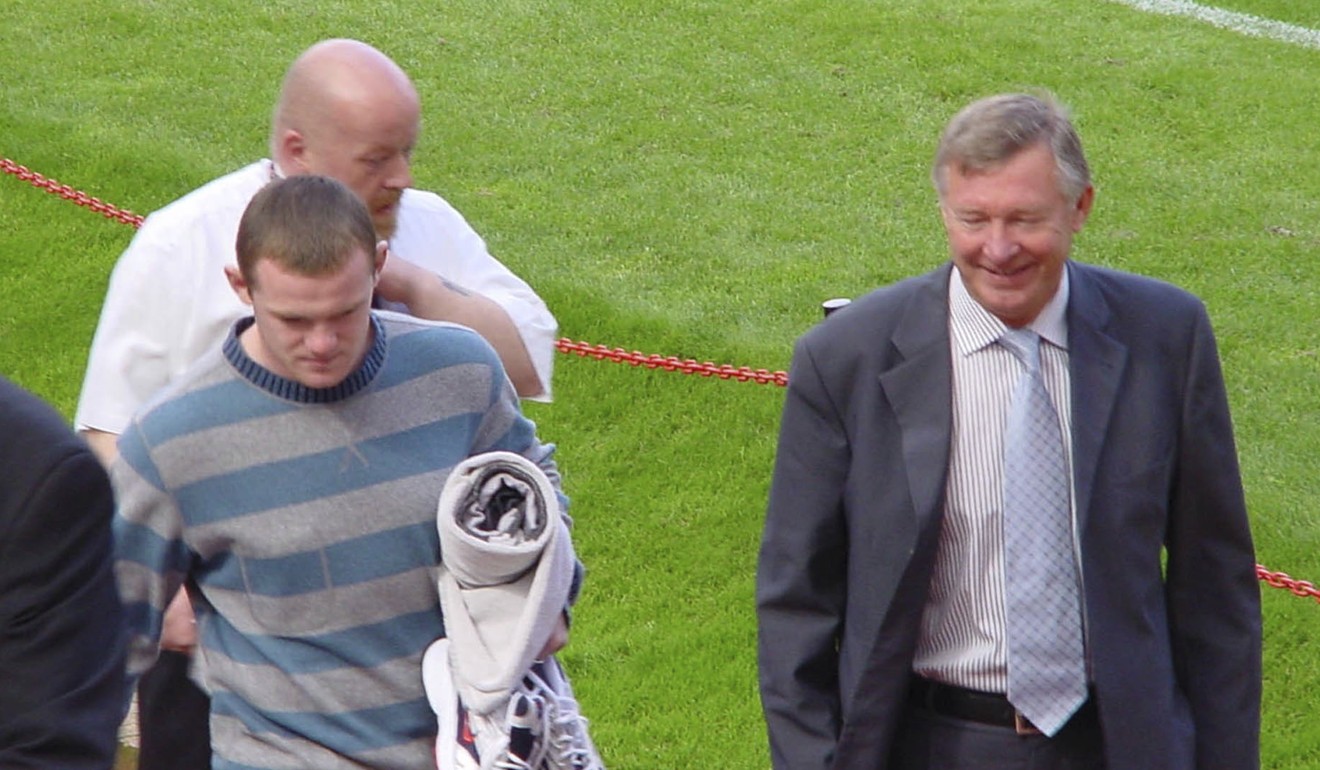 Wayne Rooney (left) with Alex Ferguson at Old Trafford on the day he signed for Manchester United. Photo: AP
