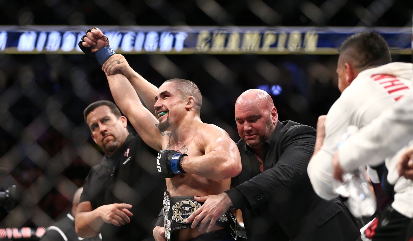 Robert Whittaker celebrates after his victory over Yoel Romero. Photo: AFP