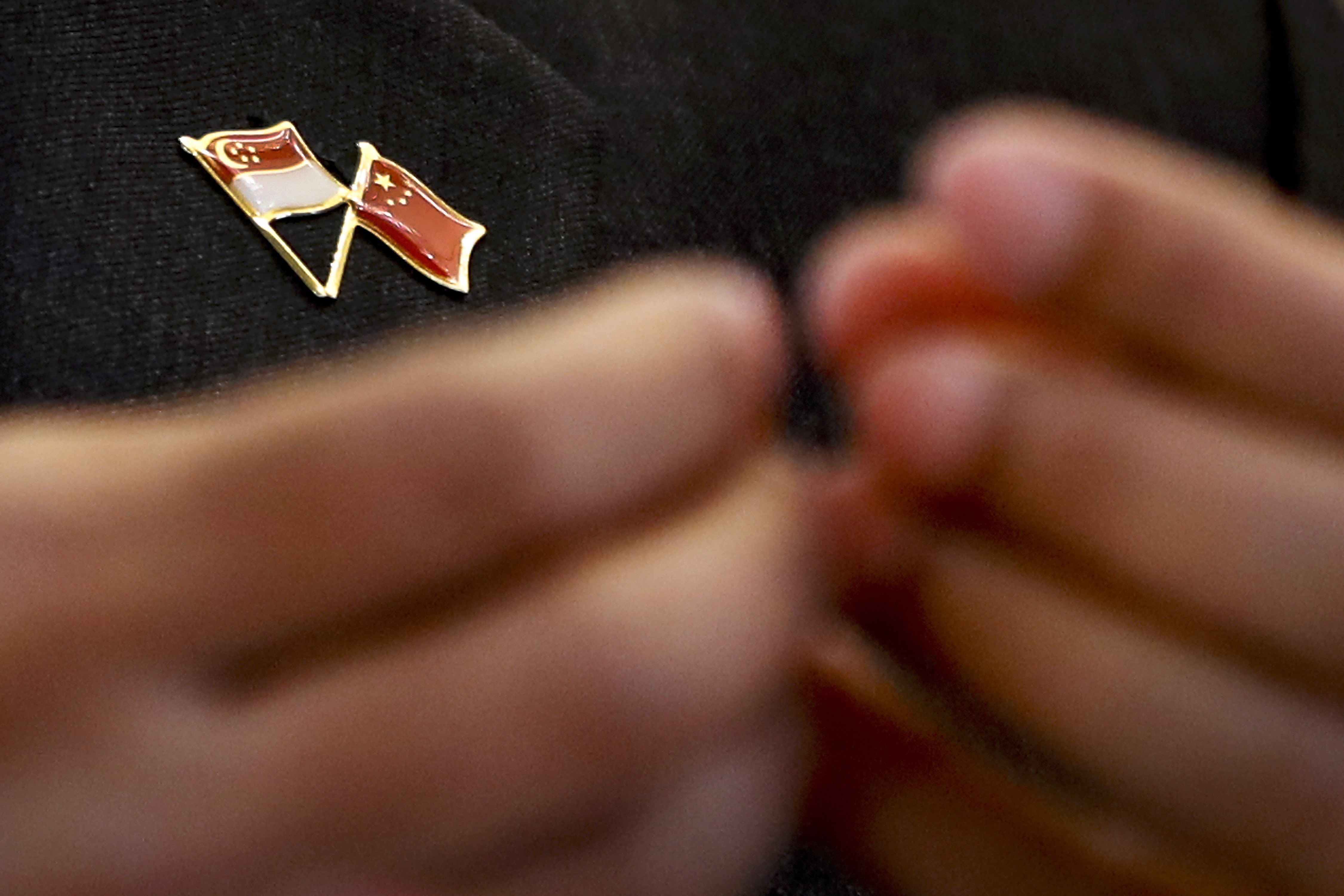 A pin bearing the Singapore and Chinese national flags is worn by Singapore’s Foreign Minister Vivian Balakrishnan, during a joint press conference with Chinese Foreign Minister Wang Yi last month at the Ministry of Foreign Affairs in Beijing. Photo: AP