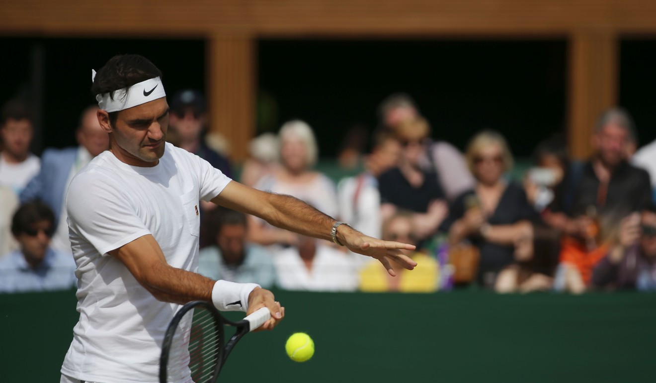 Switzerland's Roger Federer plays a shot as he attends a practise session at The All England Lawn Tennis Club in Wimbledon. Photo: AFP