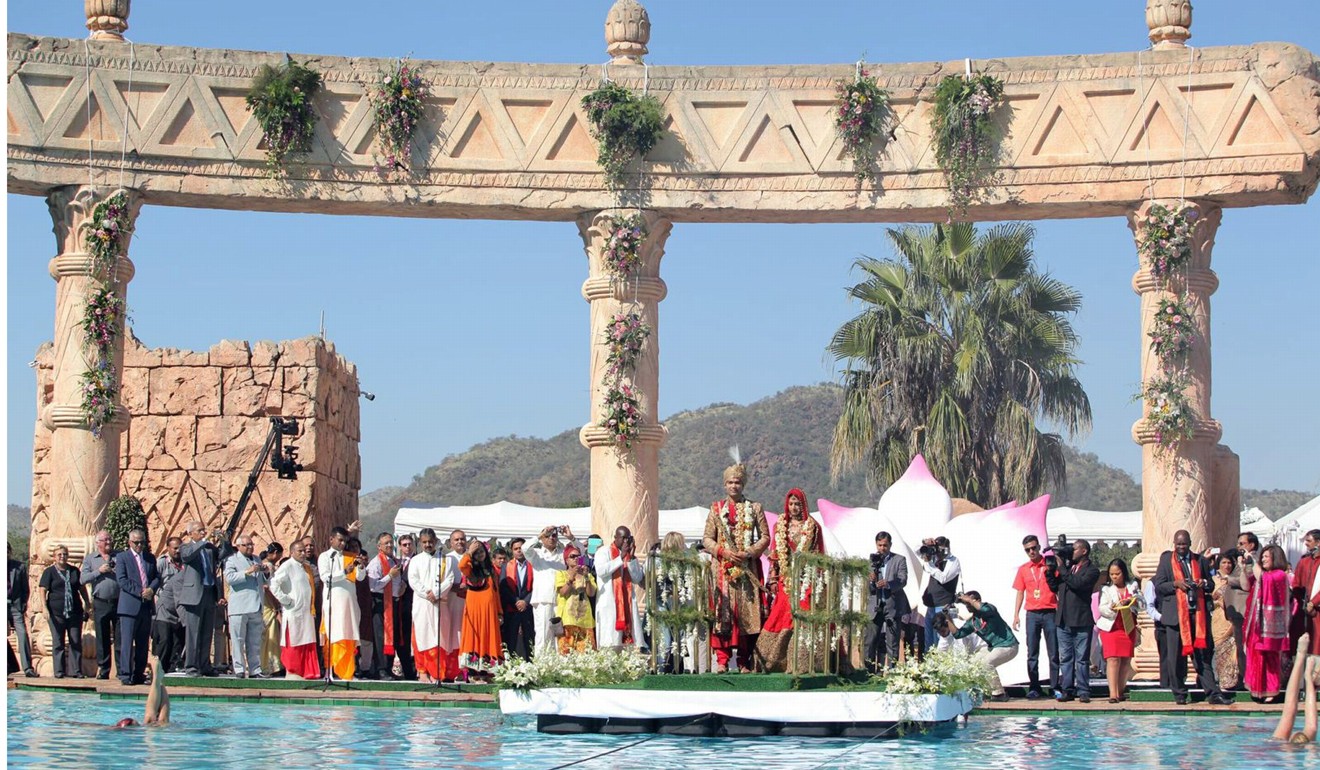 This picture courtesy of the Gupta family shows Vela Gupta and her husband, Indian-born Aaskash Jahajgarhia, posing with relatives and guests during ceremonies for their wedding in Sun City, South Africa, in 2013. South Africa suspended a slew of officials and military personnel as it tried to limit the political and diplomatic fallout from the lavish Indian wedding. Photo: AFP