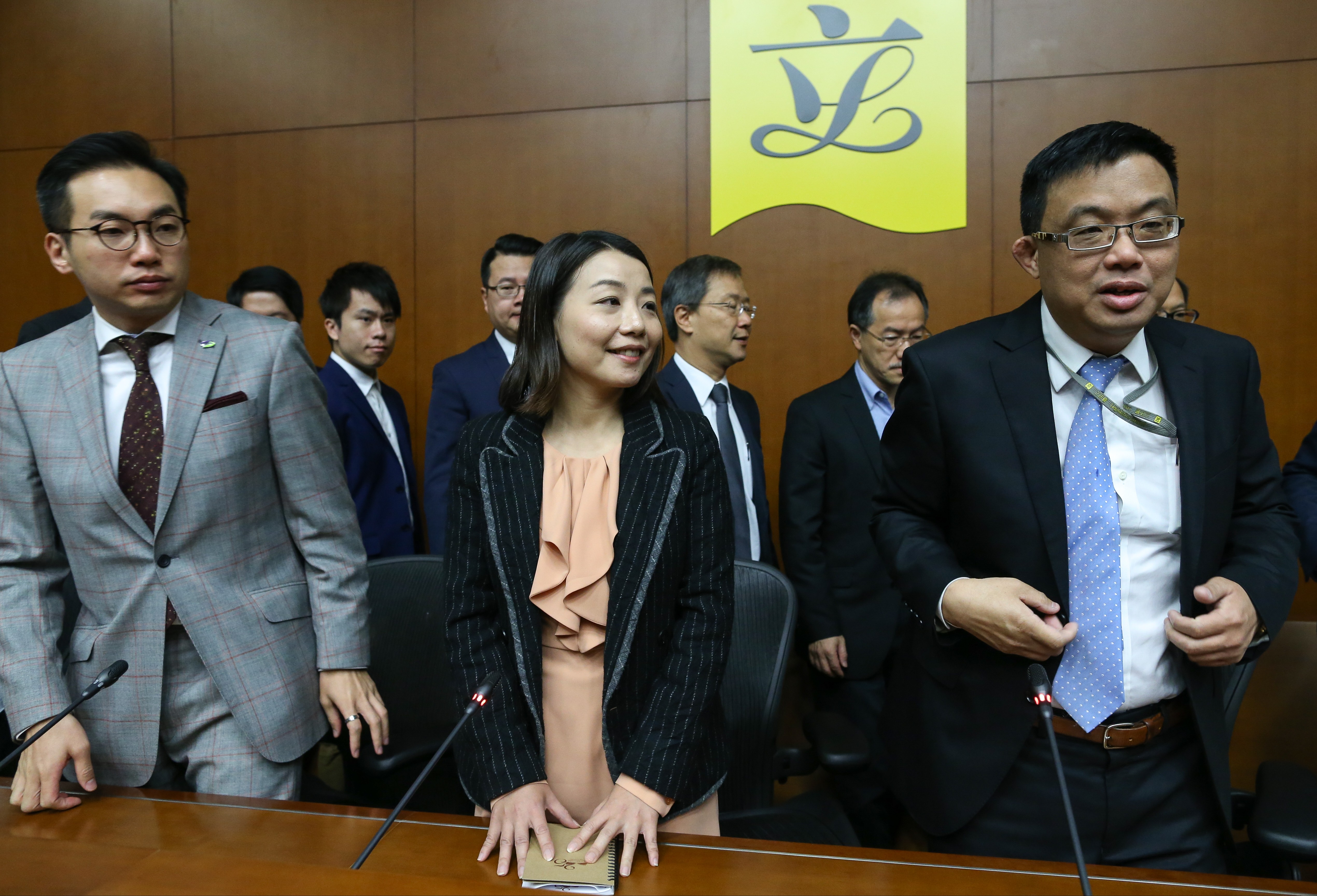 Alvin Yeung (left) and James To flank fellow lawmaker Lau Siu-lai as pro-democracy Legco members hold a press conference at Tamar last November 30. Lau is one of four lawmakers to have been disqualified by a July 14 court ruling. Photo: Dickson Lee