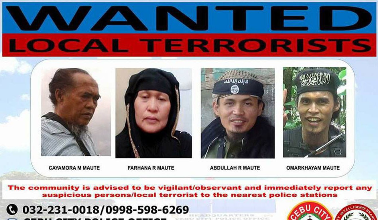A Maute family wanted poster in the Philippines includes Farhana Maute, second from left, the mother of the family. Handout photo