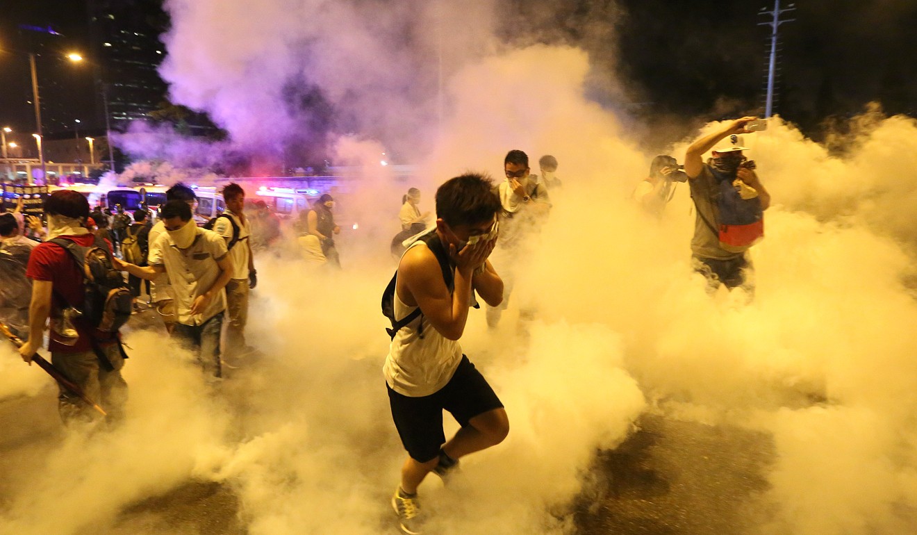 The police fire tear gas to protesters during Occupy Central in September 2014.