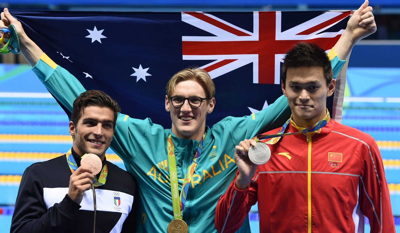 Gold medal winner Mack Horton of Australia poses with China’s Sun Yang and Italy’s Gabriele Detti after men's 400m freestyle final. Photo: EPA