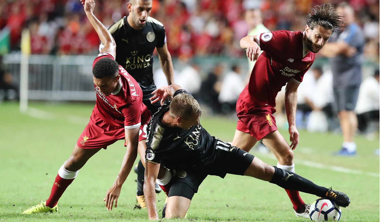 Liverpool’s Trent Alexander-Arnold and Adam Lallana (right) challenge Leicester’s Marc Albrighton.
