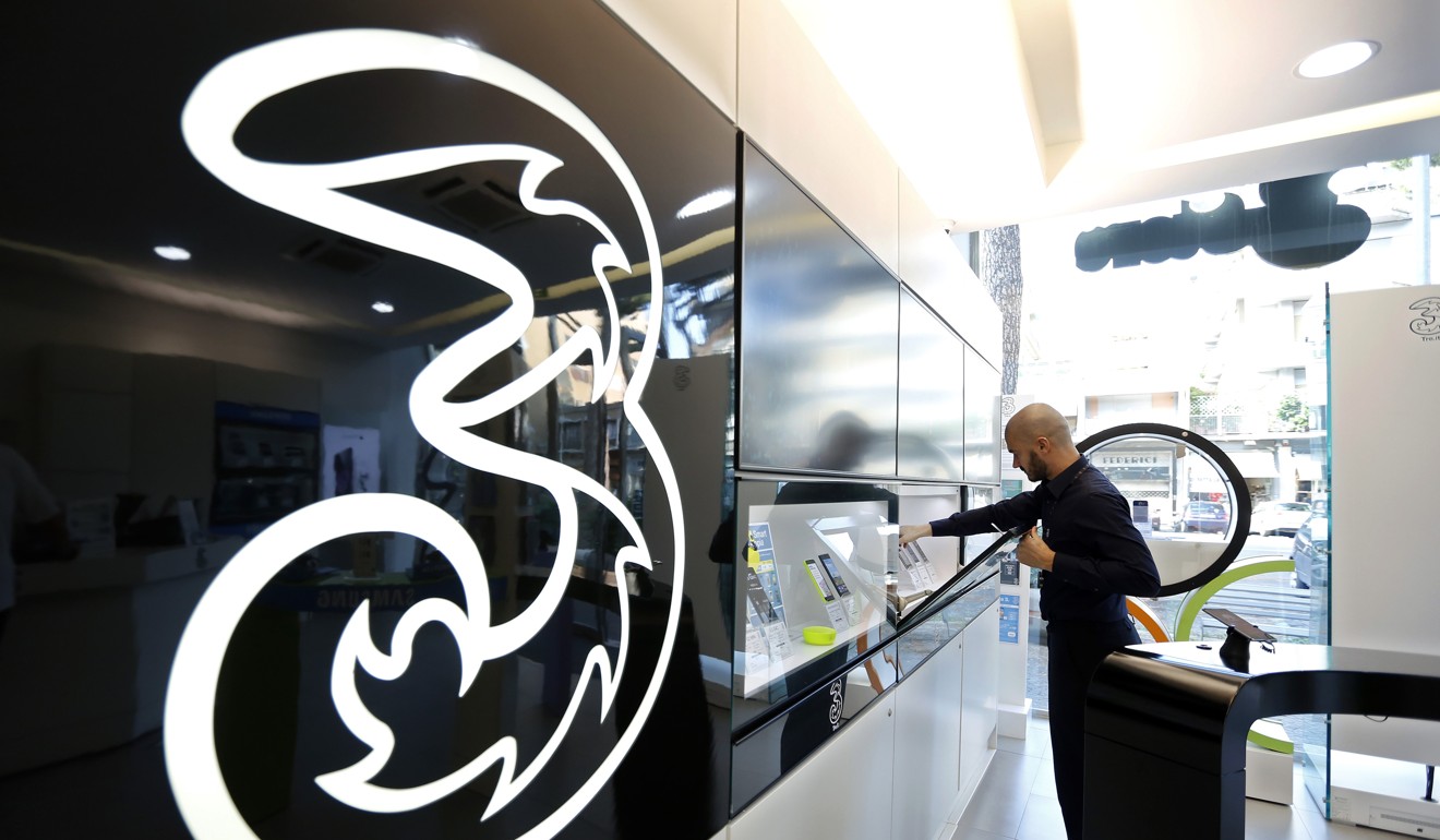 First-half revenue at the operator’s mobile business, which operates under the “Three” brand in Hong Kong and Macau, totaled HK$3.1 billion, down from HK3.5 billion in the same period last year. Photo: Bloomberg