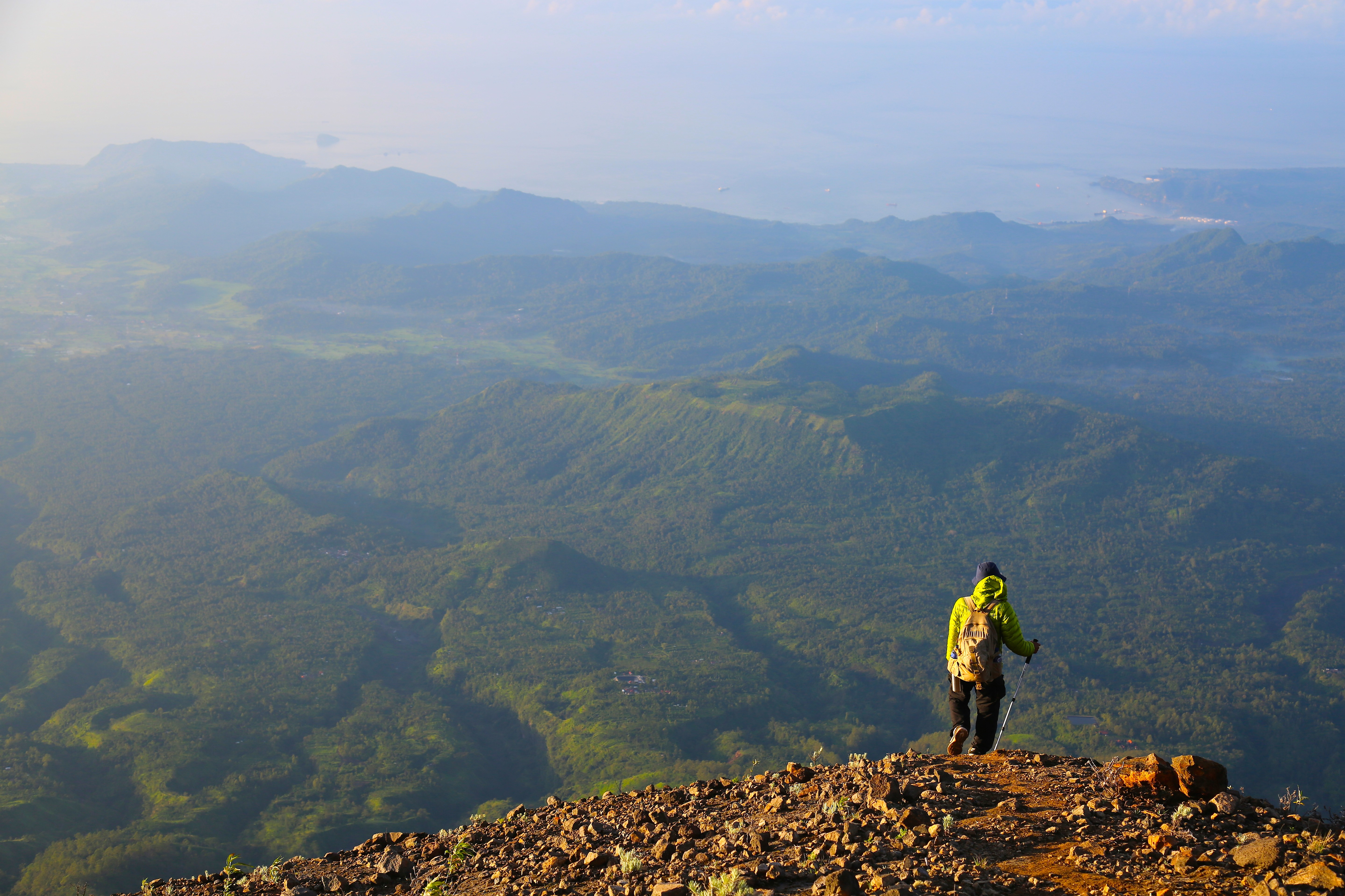 Hiking guide Wayan Ariana contemplates the views of Bali’s coastline on the descent of Mount Agung. Photo: Graeme Green