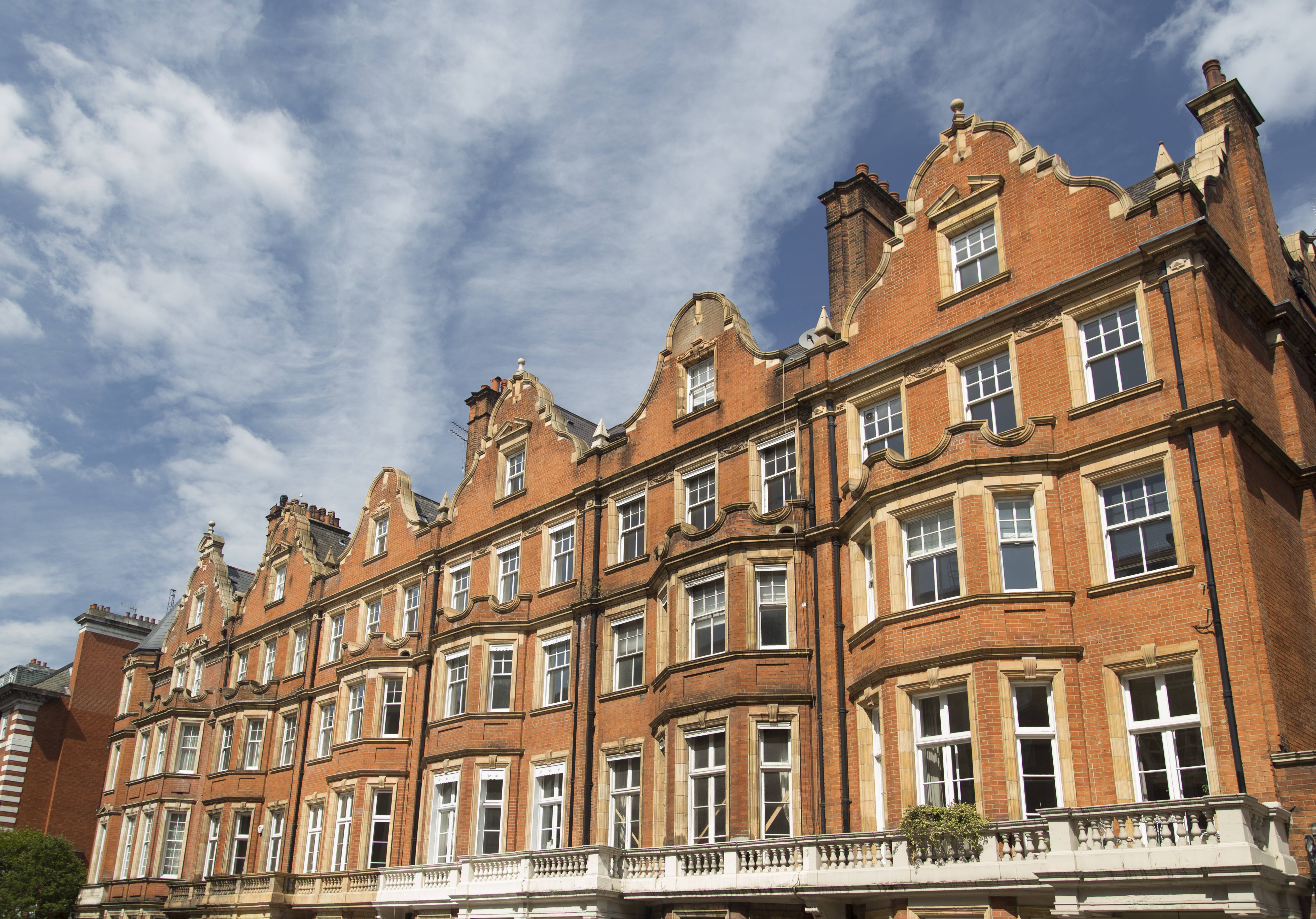 A row of red brick apartments in Mayfair – a prime target for Asian buyers. Photo: Getty Images/iStockphoto