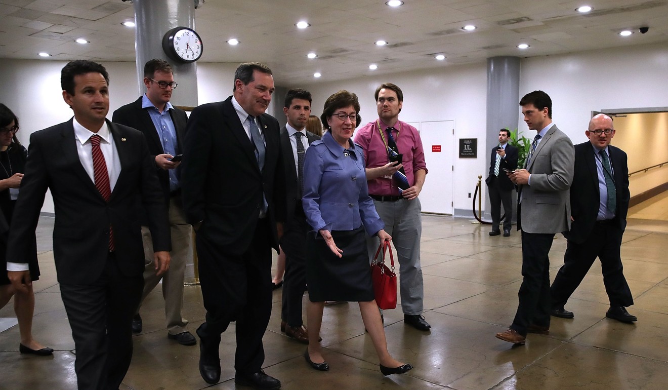 Democratic Party Senators Brian Schatz and Joe Donnelly and Republican Susan Collin walk to the US Capitol on Wednesday to vote on efforts to repeal and replace the Affordable Care Act, also known as Obamacare. All three voted against the measure. Photo: AFP